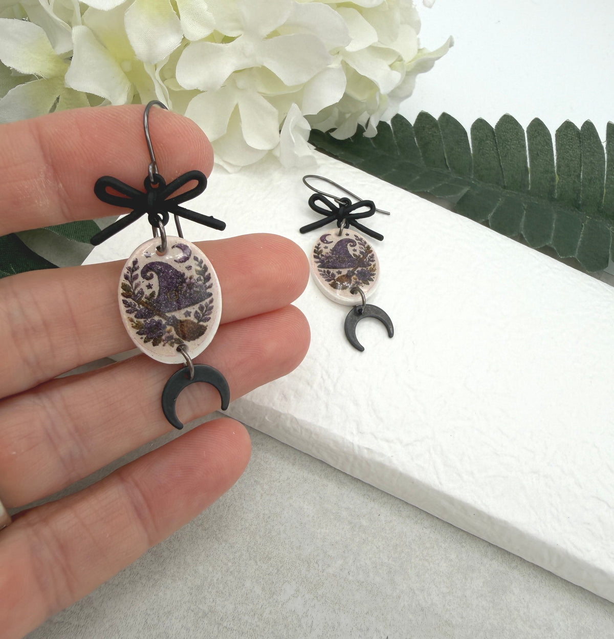 Earrings Made with Black Bow LInks and Polymer Clay Ovals with a Witch Hat Design and Oxidized Silver Earring Wires PCE-1085