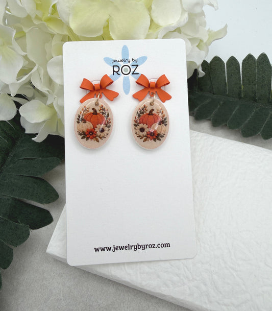 Earrings Made with Orange Bow Posts and Polymer Clay Ovals with a Pumpkin Design PCE-1089