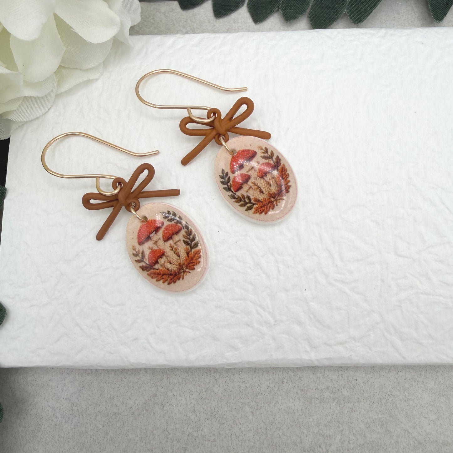 Earrings Made with Brown Bow LInks and Polymer Clay Ovals with a Mushroon Design and Gold Filled Earring Wires PCE-1092