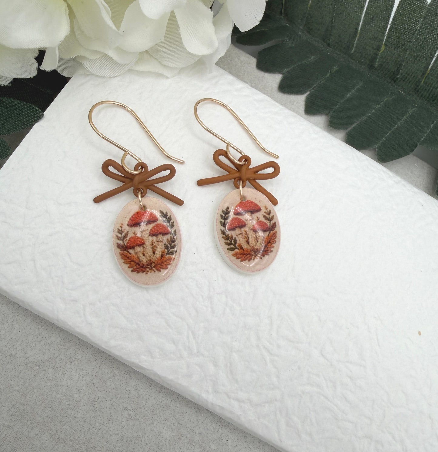 Earrings Made with Brown Bow LInks and Polymer Clay Ovals with a Mushroon Design and Gold Filled Earring Wires PCE-1092