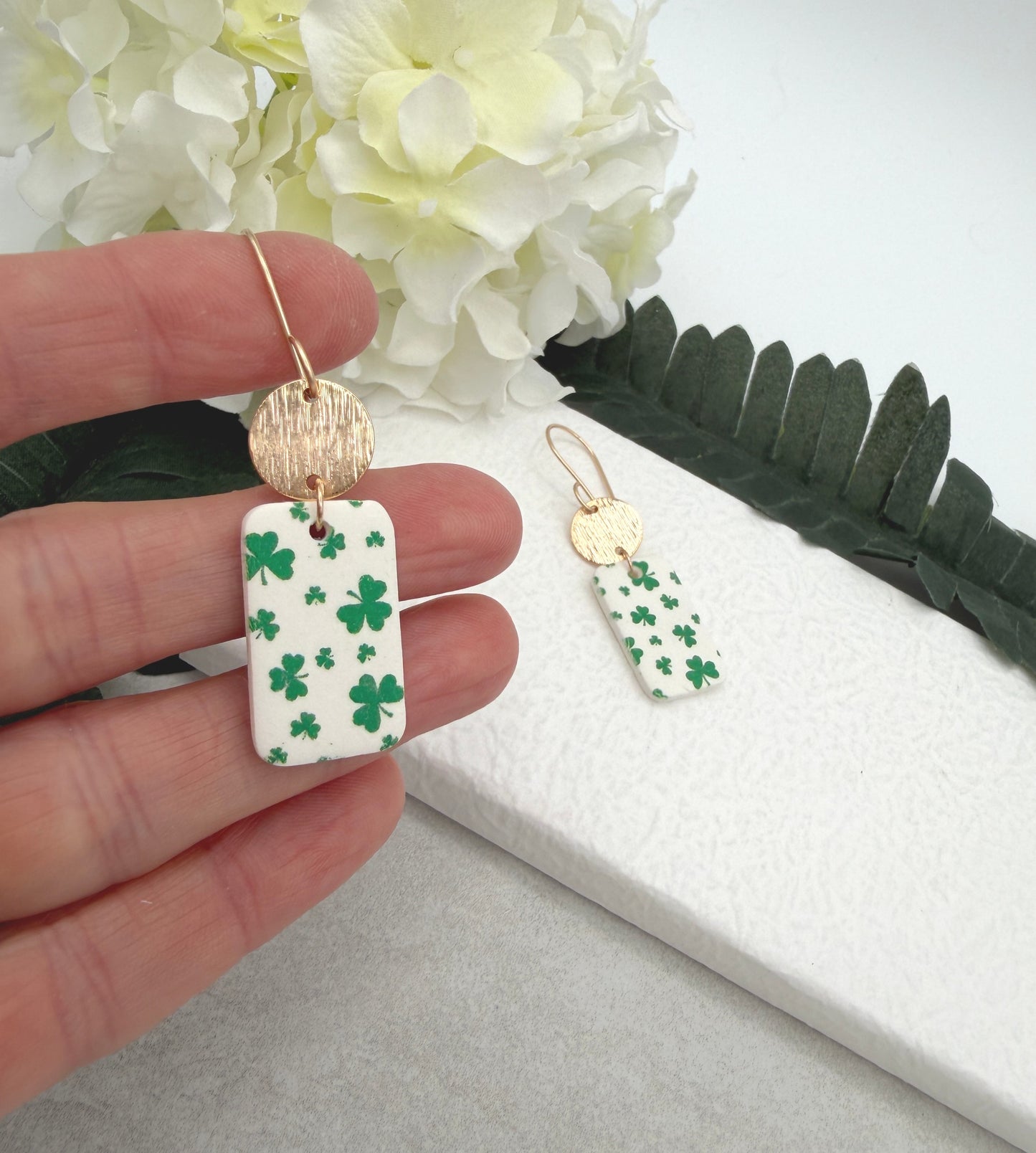 Earrings Made with White Polymer Clay Rectangles with a Green Clover Design and Gold Plated Circles - PCE-967