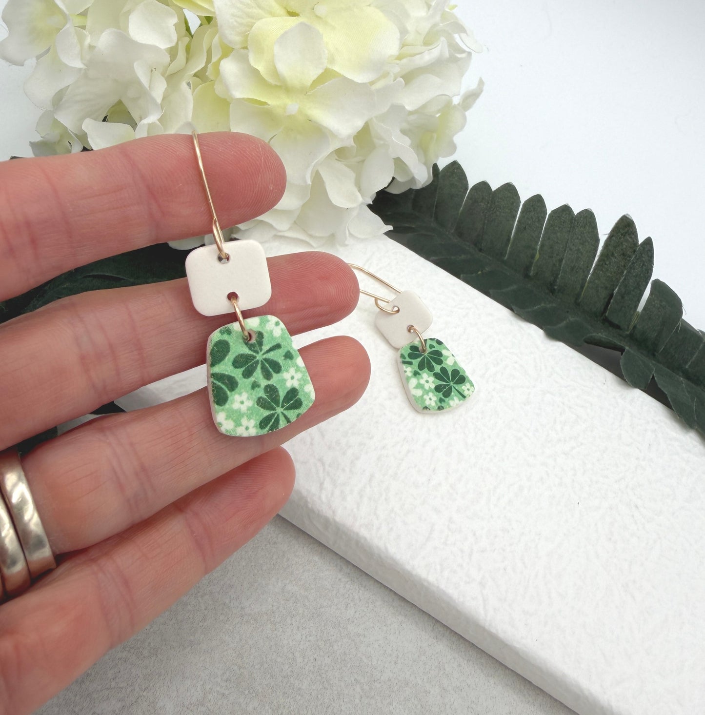Earrings Made with White Polymer Clay Squares and Trapezoids with a Green Clover Design - PCE-969