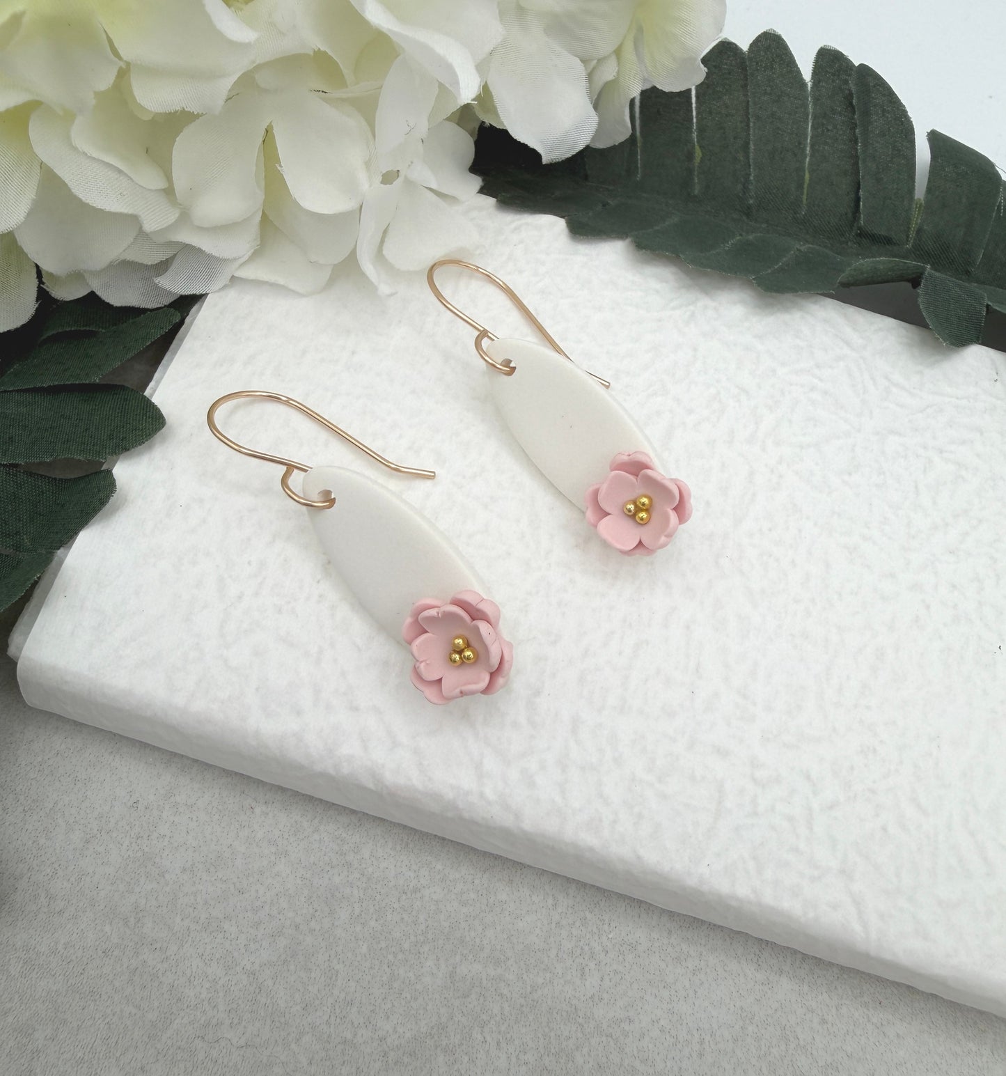 Earrings Made with White Polymer Clay Ovals and Pink Flowers - PCE-986