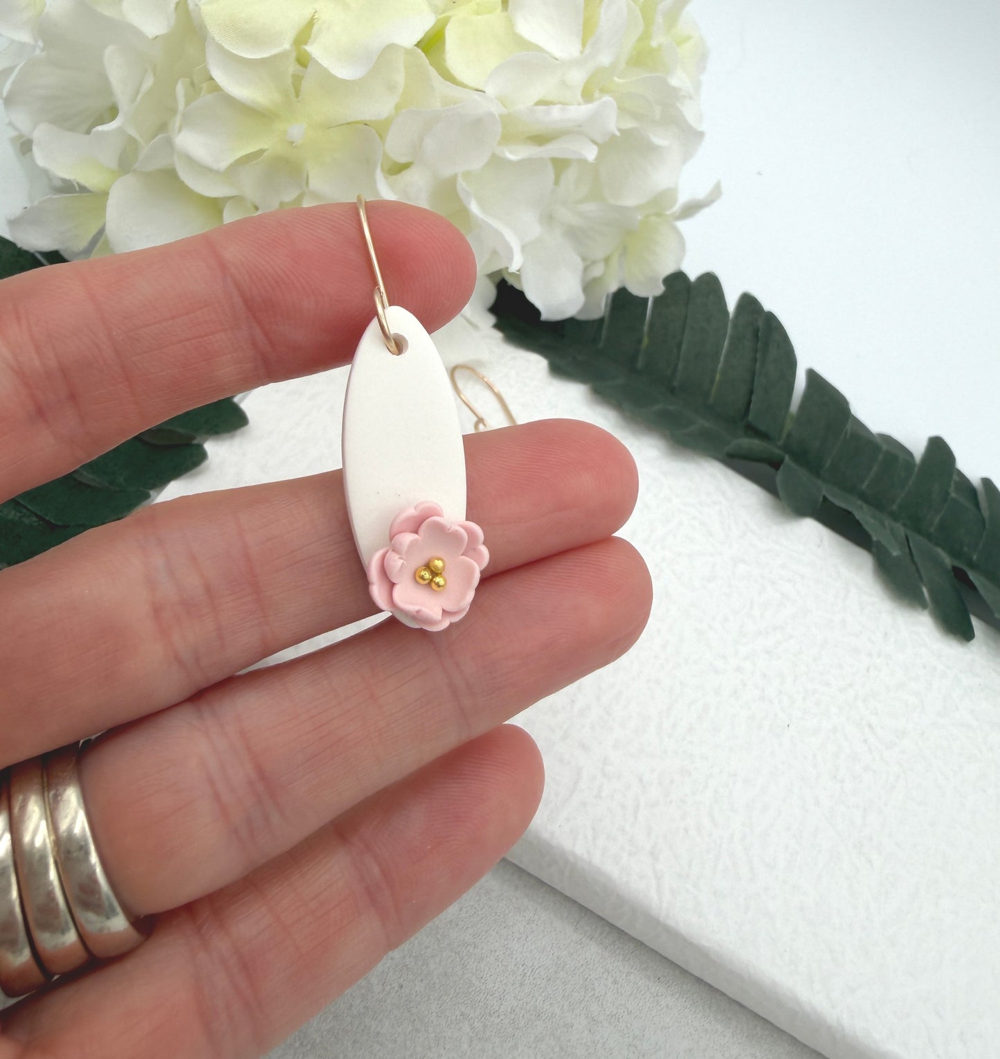 Earrings Made with White Polymer Clay Ovals and Pink Flowers - PCE-986