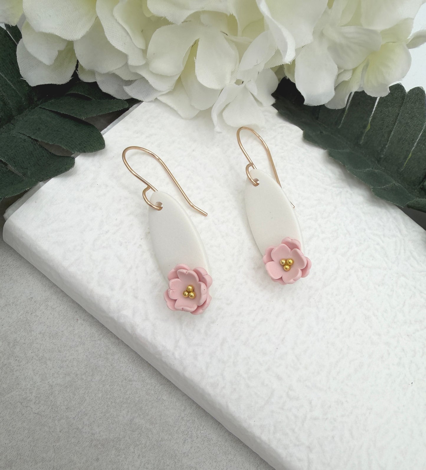 Earrings Made with White Polymer Clay Ovals and Pink Flowers - PCE-986