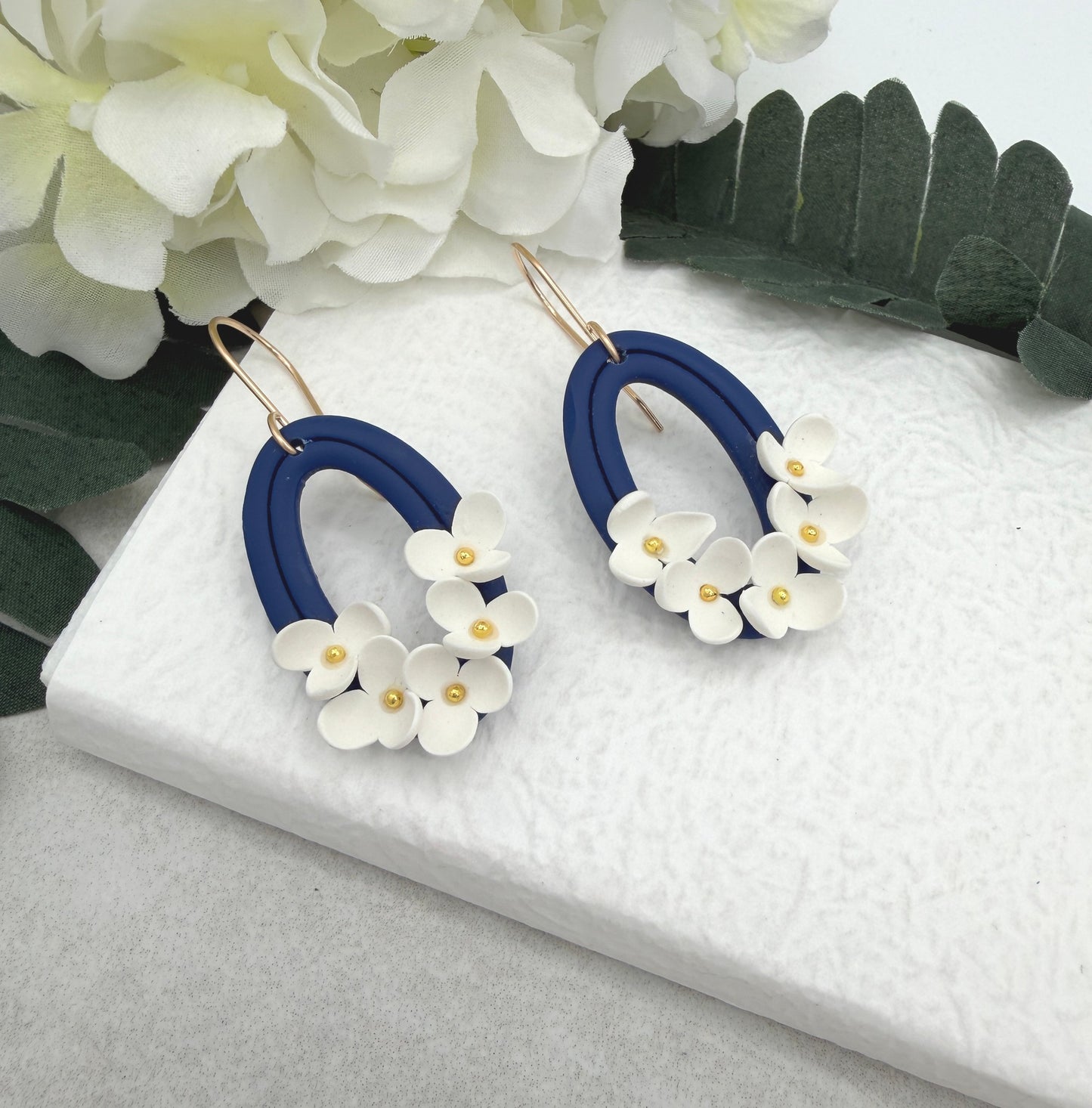 Earrings Made with Navy Polymer Clay Oval Frames and White Flowers - PCE-992