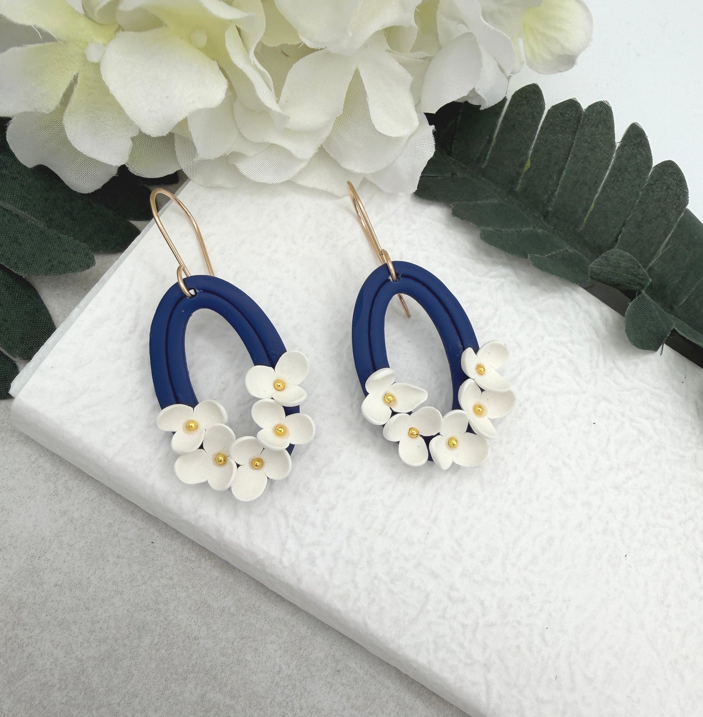 Earrings Made with Navy Polymer Clay Oval Frames and White Flowers - PCE-992