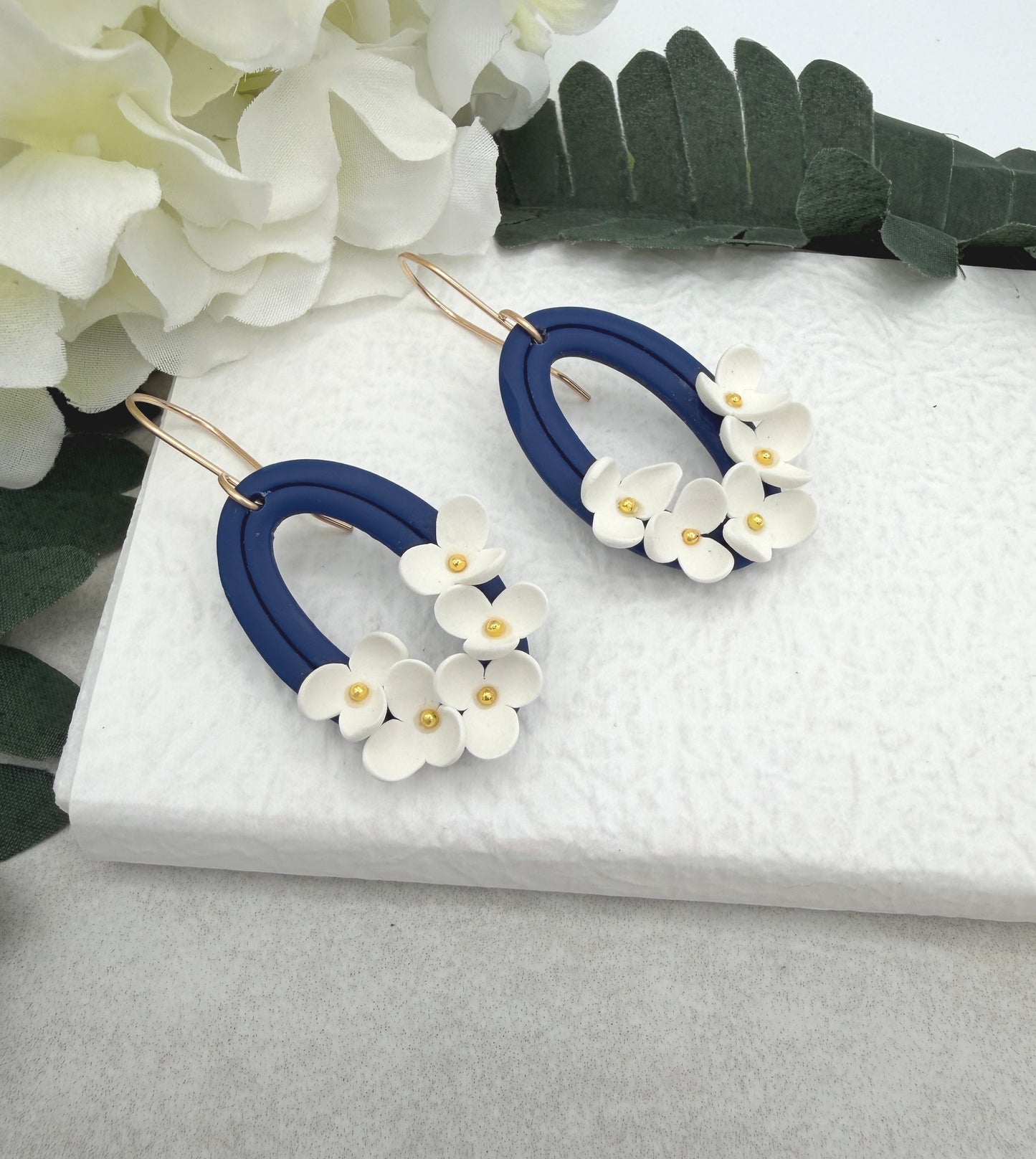Earrings Made with Navy Polymer Clay Oval Frames and White Flowers - PCE-992