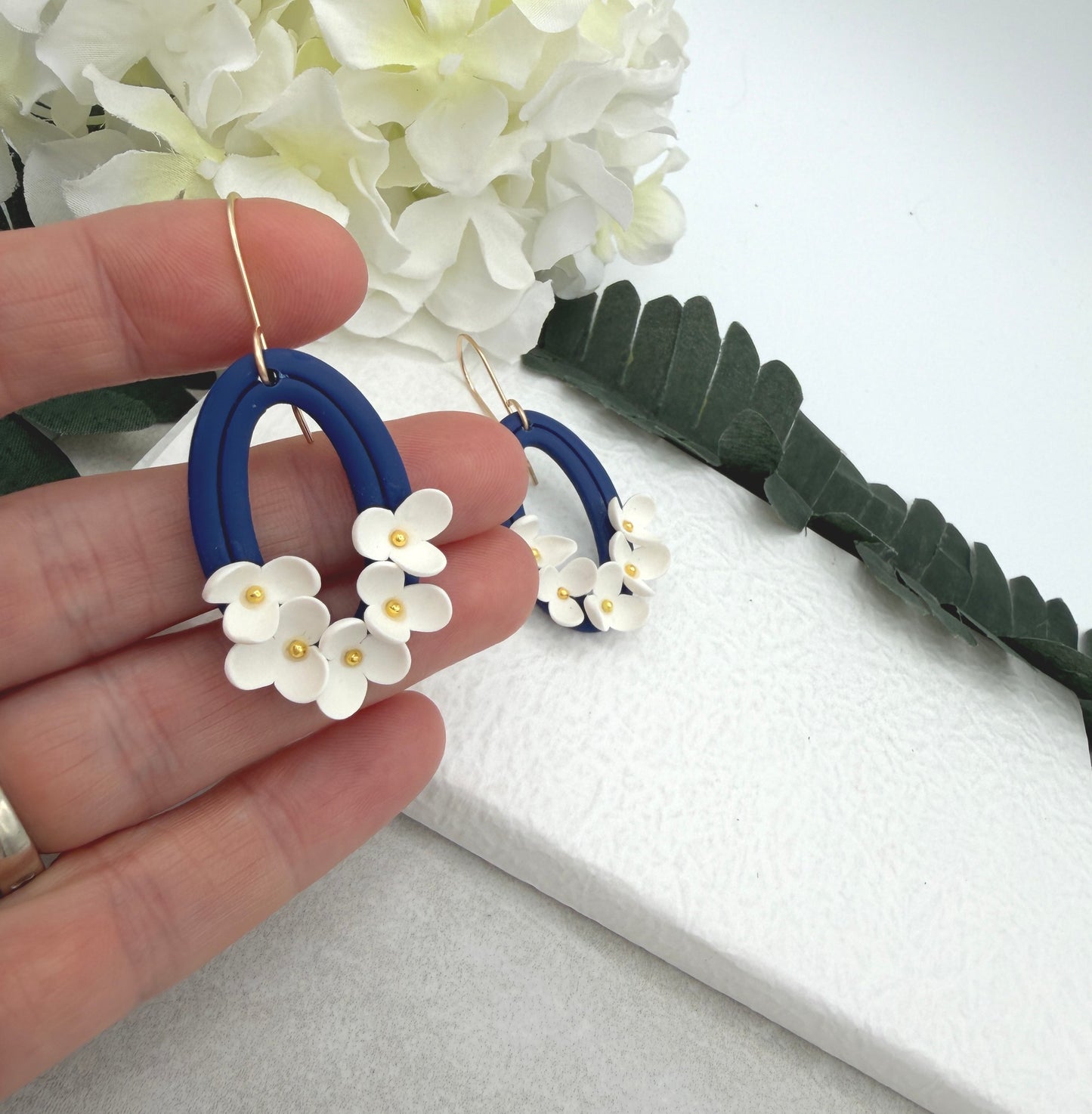 Earrings Made with Navy Polymer Clay Oval Frames and White Flowers - PCE-992