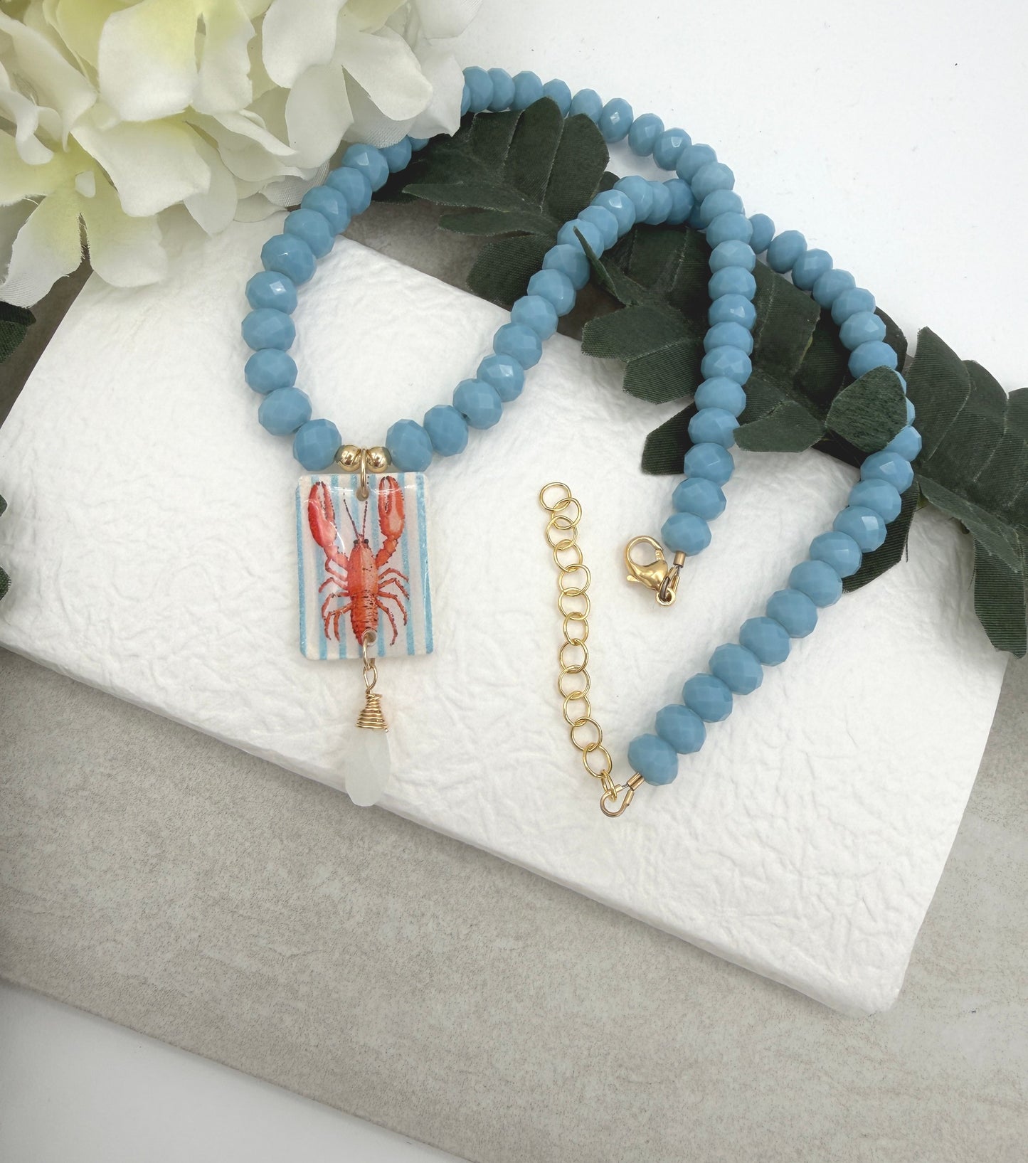Necklace with Blue Crystal Beads with a Polymer Clay Lobster and White Crystal Pendant PCN-42
