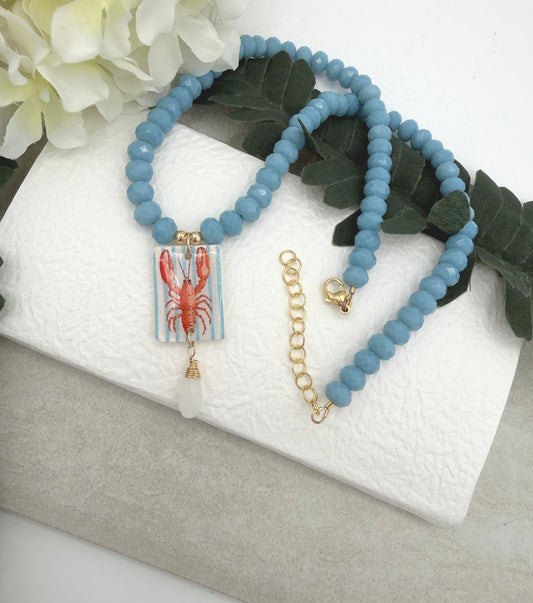 Necklace with Blue Crystal Beads with a Polymer Clay Lobster and White Crystal Pendant PCN-42