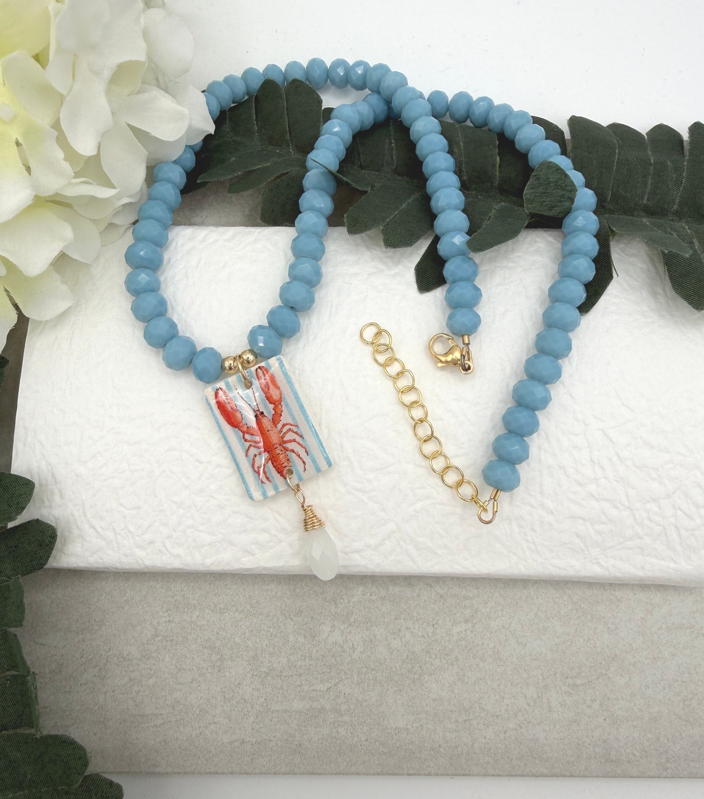 Necklace with Blue Crystal Beads with a Polymer Clay Lobster and White Crystal Pendant PCN-42