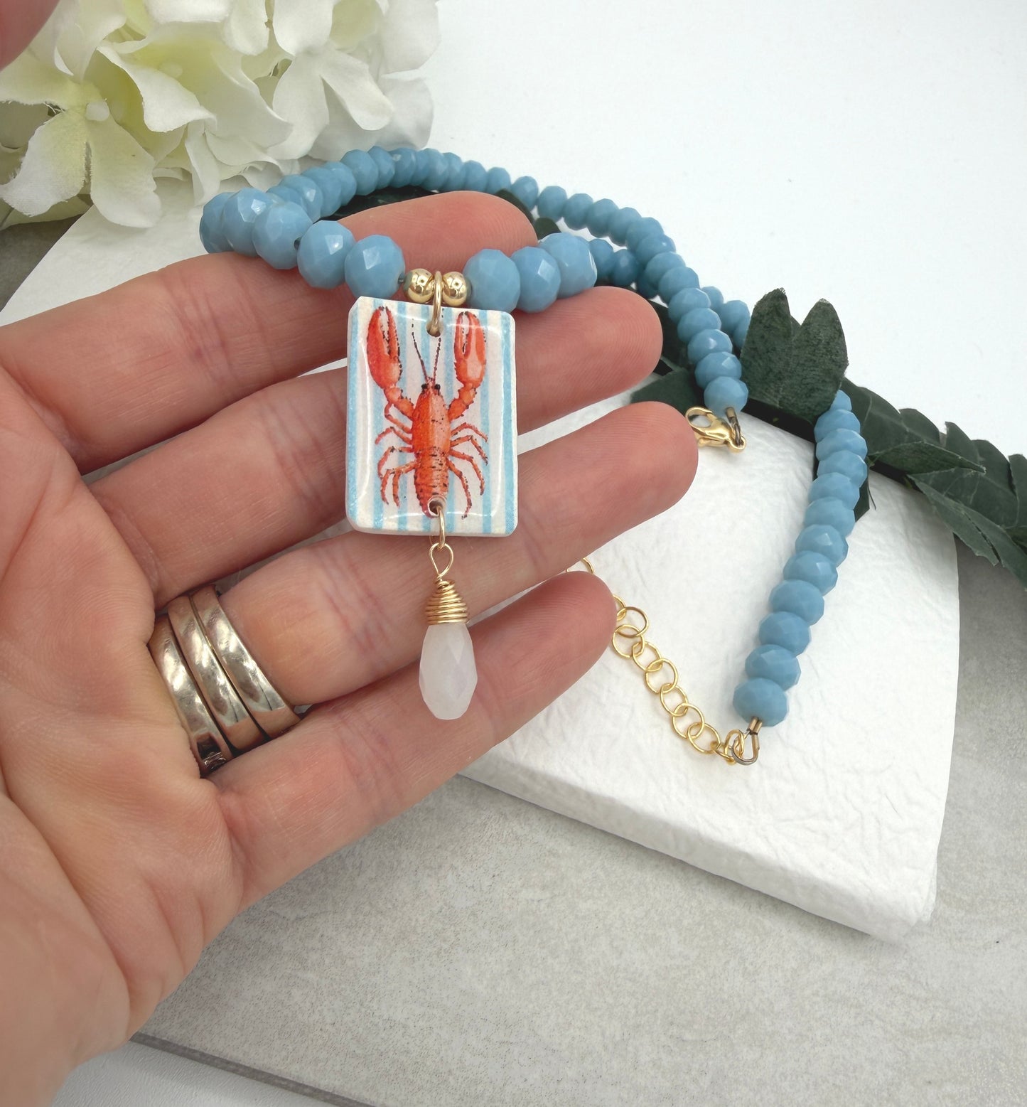 Necklace with Blue Crystal Beads with a Polymer Clay Lobster and White Crystal Pendant PCN-42