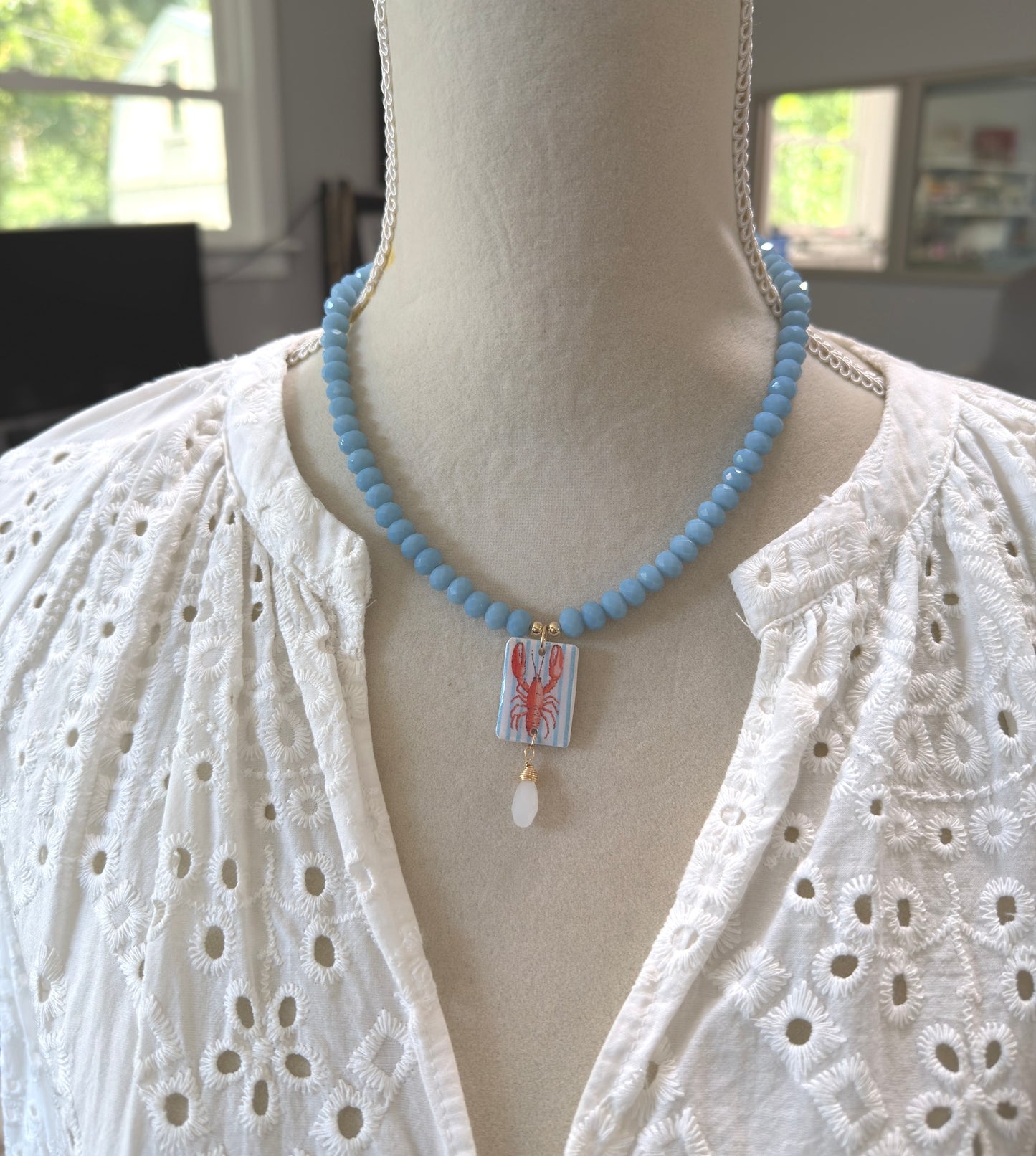 Necklace with Blue Crystal Beads with a Polymer Clay Lobster and White Crystal Pendant PCN-42