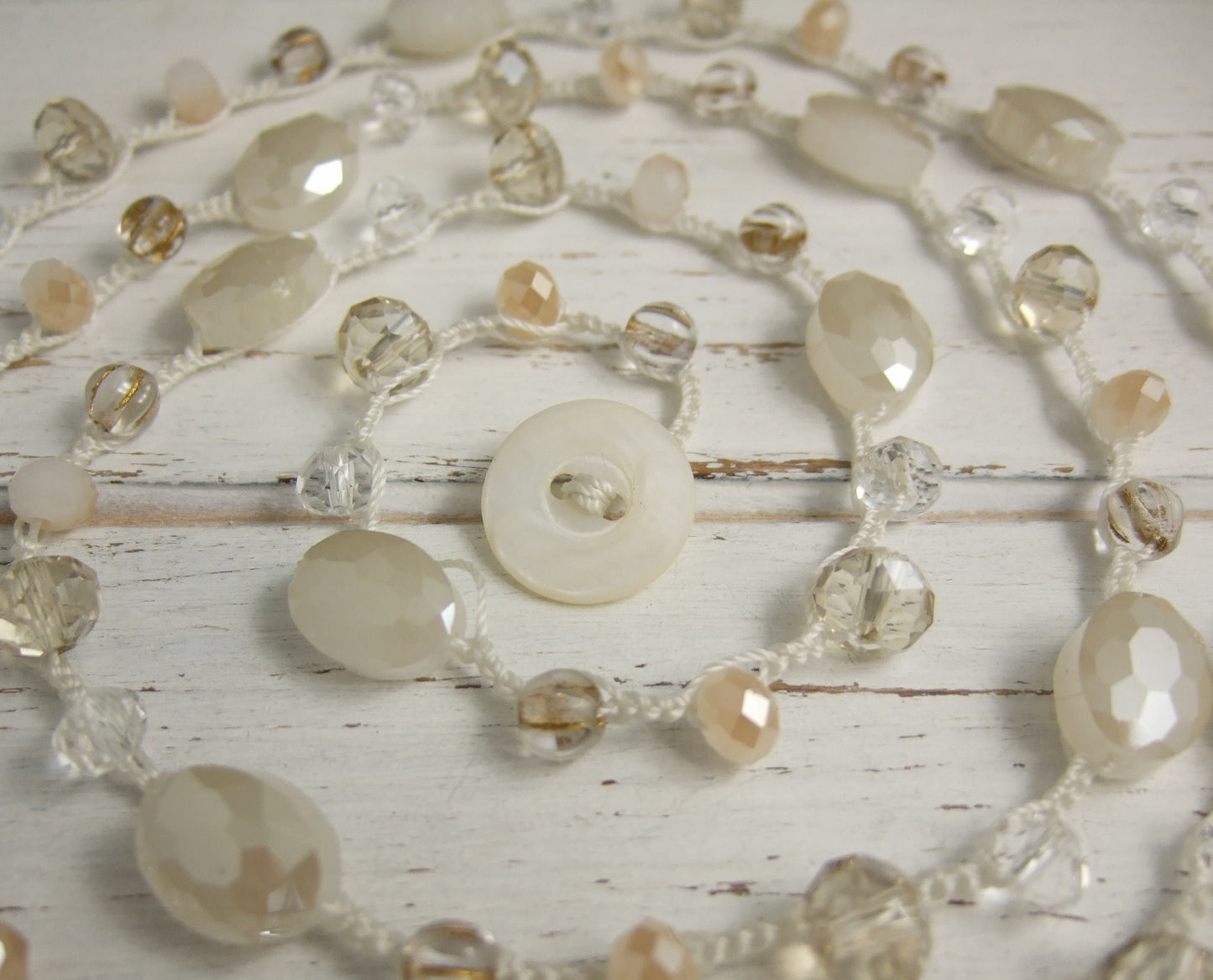 A Long Crocheted Necklace with a Cream Cord, Cream, Gold and Crystal Czech Glass Beads SN-524