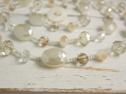 A Long Crocheted Necklace with a Cream Cord, Cream, Gold and Crystal Czech Glass Beads SN-524