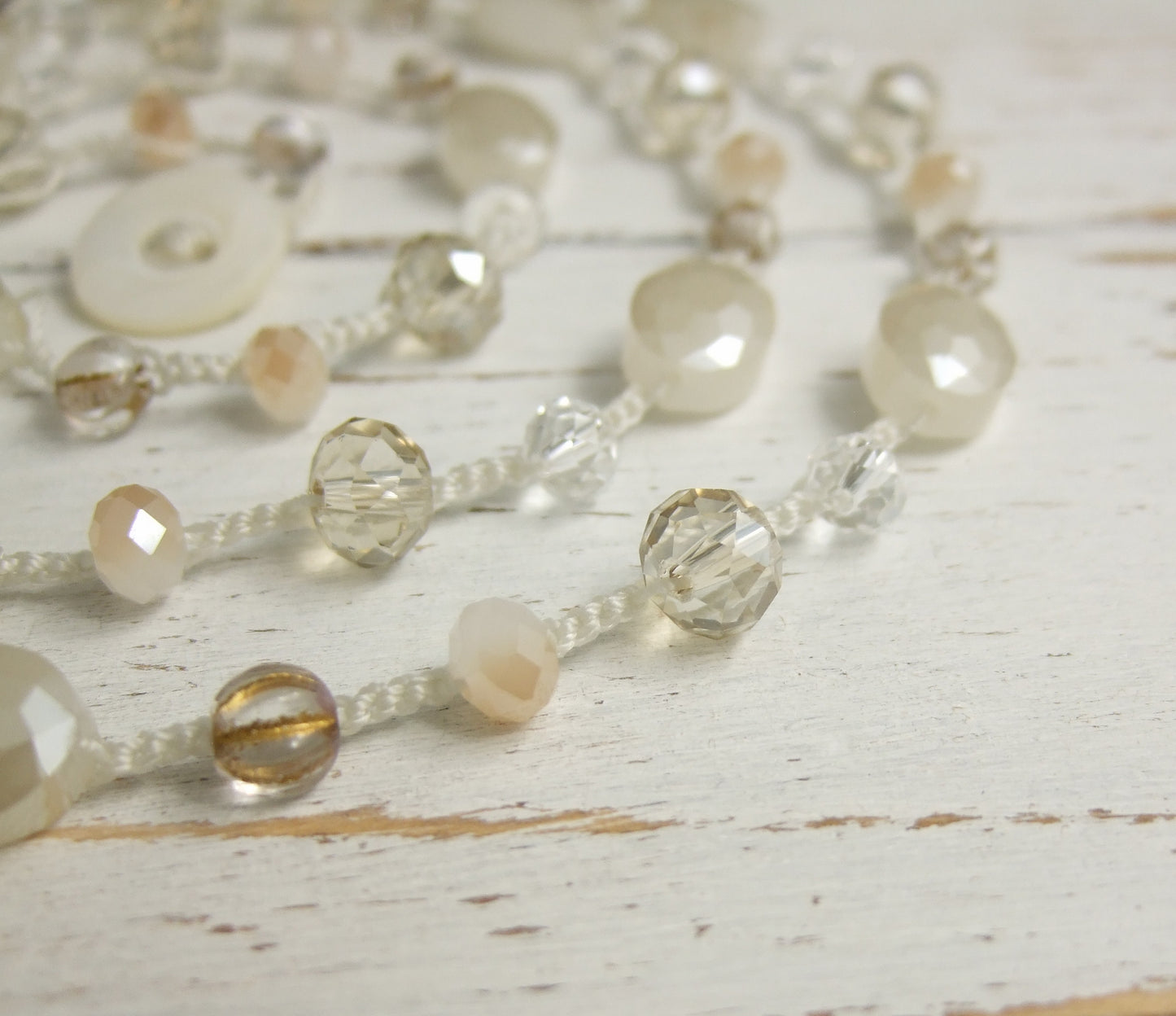 A Long Crocheted Necklace with a Cream Cord, Cream, Gold and Crystal Czech Glass Beads SN-524