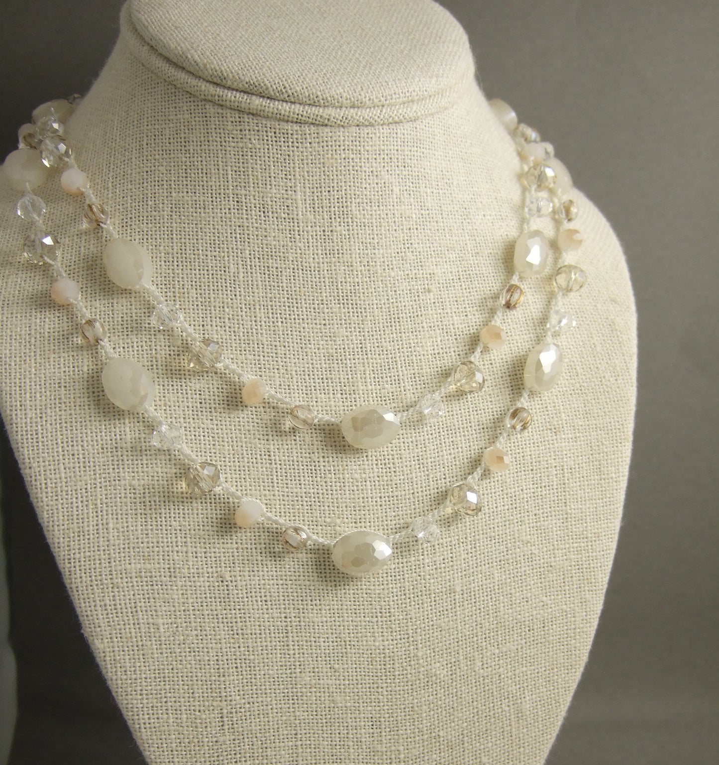 A Long Crocheted Necklace with a Cream Cord, Cream, Gold and Crystal Czech Glass Beads SN-524