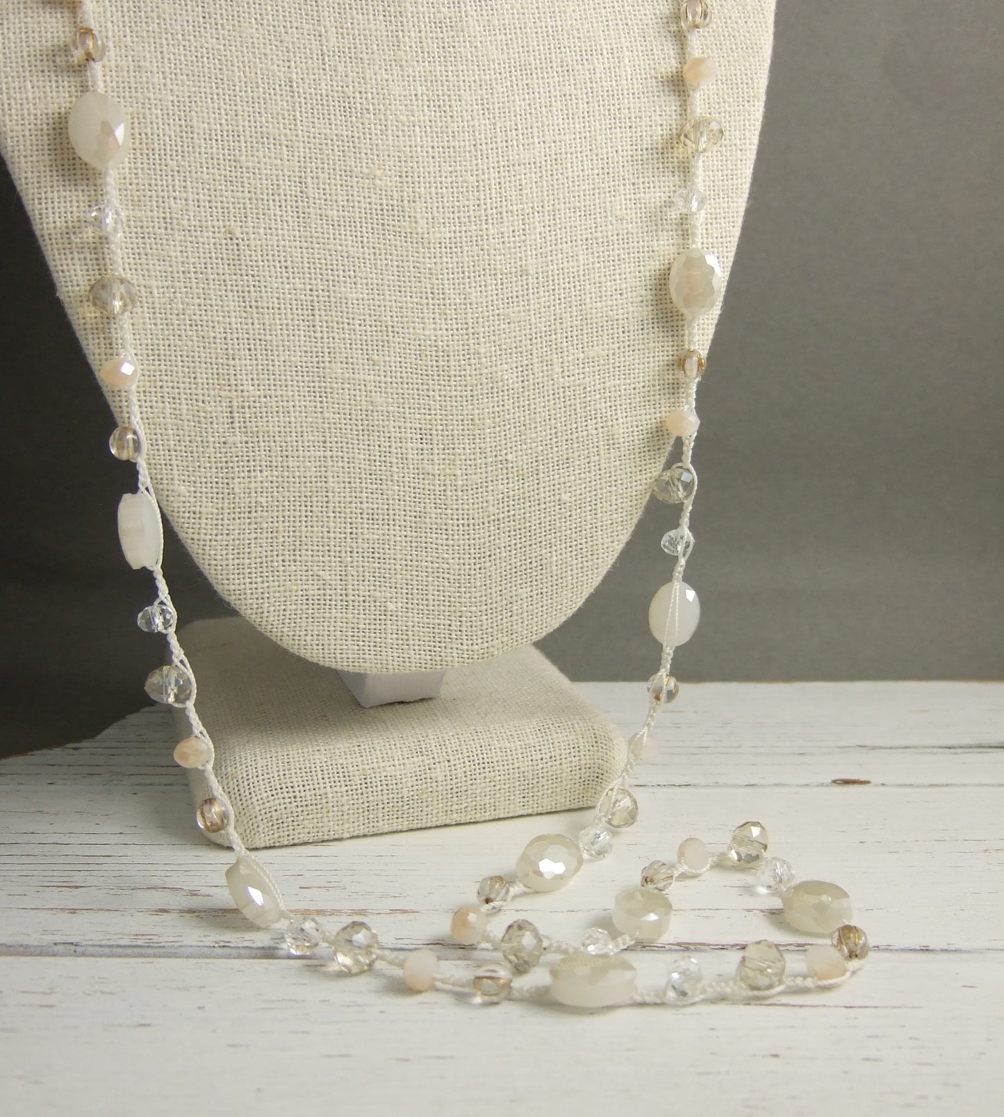 A Long Crocheted Necklace with a Cream Cord, Cream, Gold and Crystal Czech Glass Beads SN-524