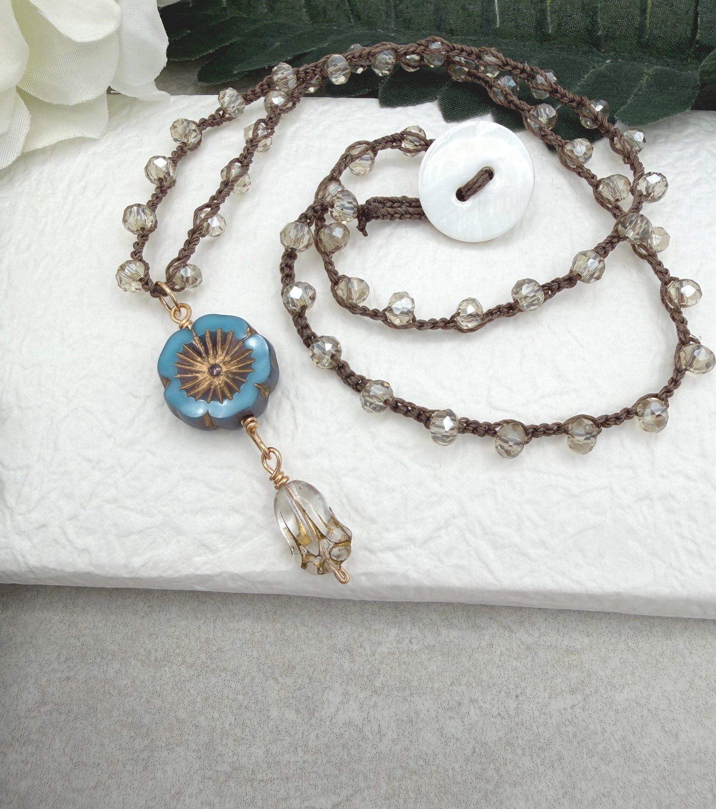Crocheted Necklace with a Brown Cord, Crystal Beads, a Czech Glass Blue Flower, and Gold Glass Tulip Bead SN-675