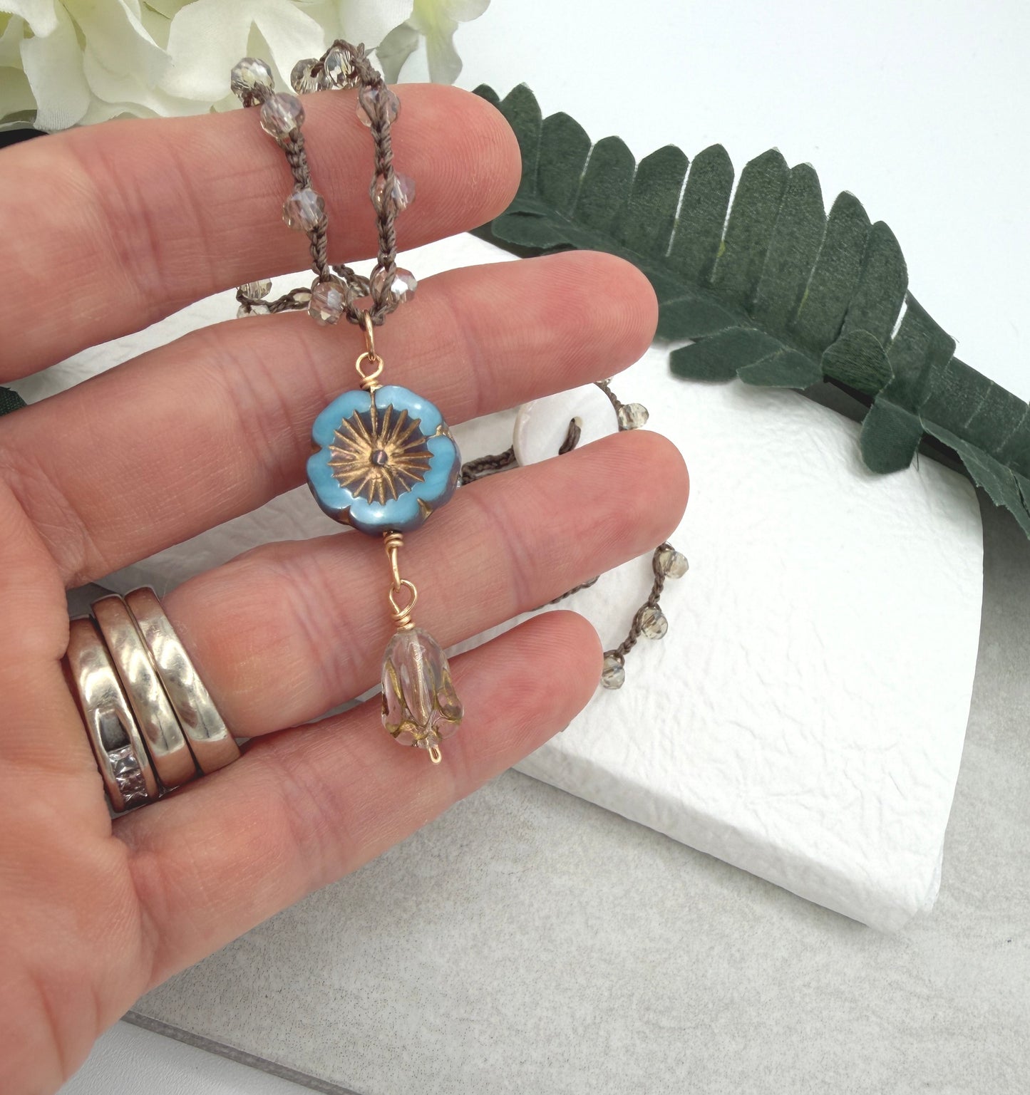 Crocheted Necklace with a Brown Cord, Crystal Beads, a Czech Glass Blue Flower, and Gold Glass Tulip Bead SN-675