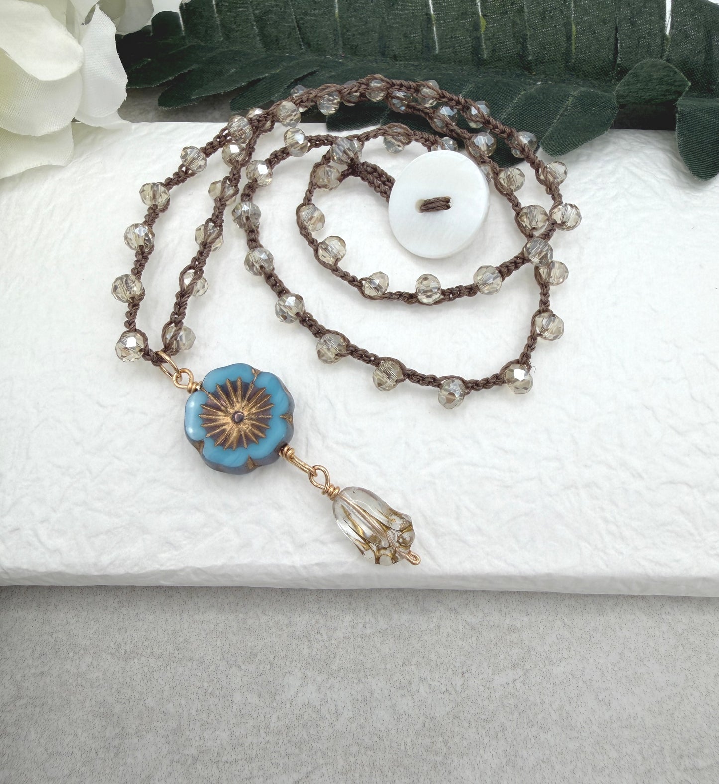 Crocheted Necklace with a Brown Cord, Crystal Beads, a Czech Glass Blue Flower, and Gold Glass Tulip Bead SN-675