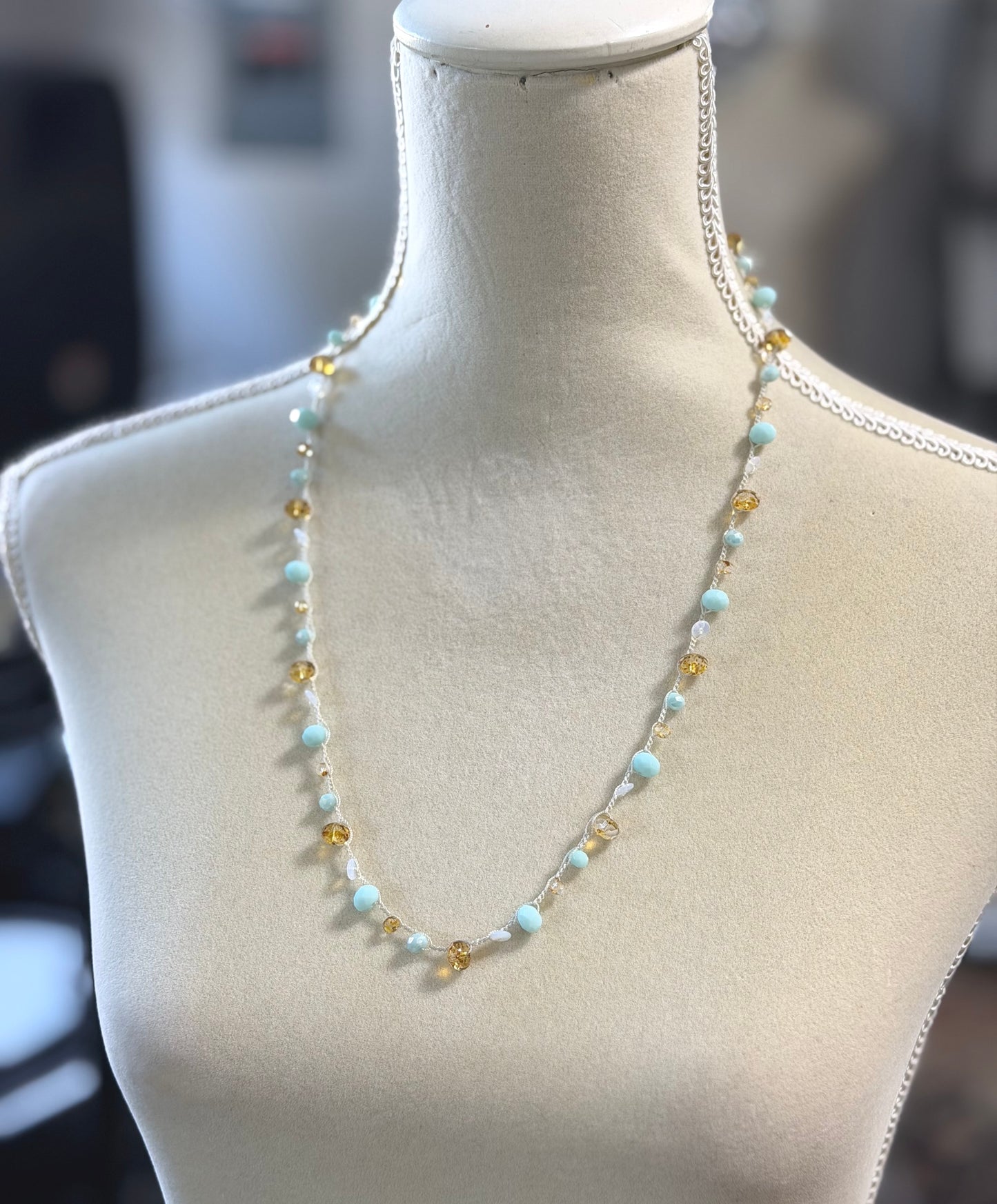 A Long Crocheted Necklace with an Ivory Cord With Aqua, Gold and Mily White Czech Glass Ronds SN-685