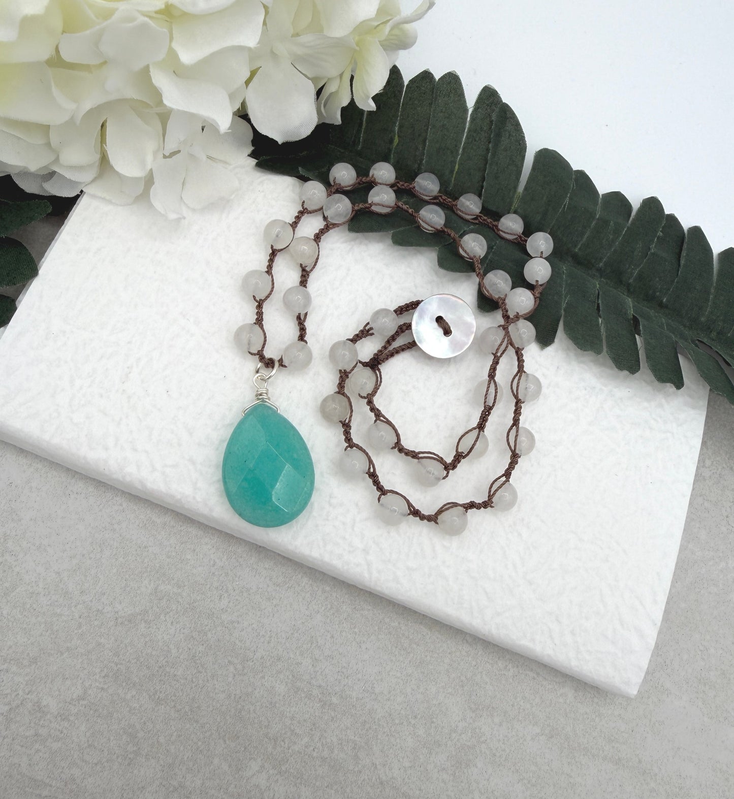 Crocheted Necklace with a Brown Cord, White Jade Beads and a Large, Aqua Jade Teardrop SN-686