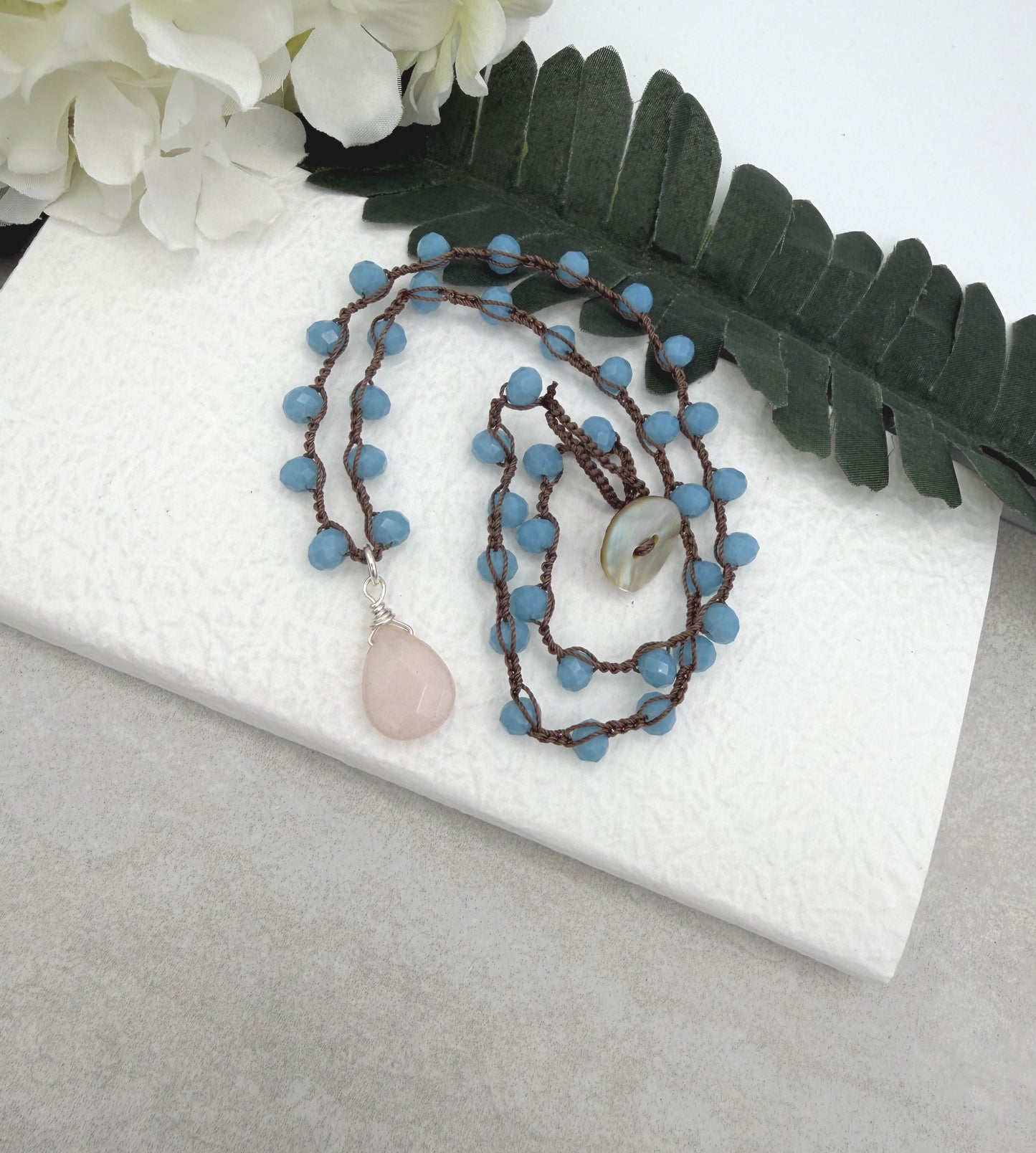 Crocheted Necklace with a Brown Cord, Blue Crystal Beads and a Pale Pink Jade Teardrop SN-687