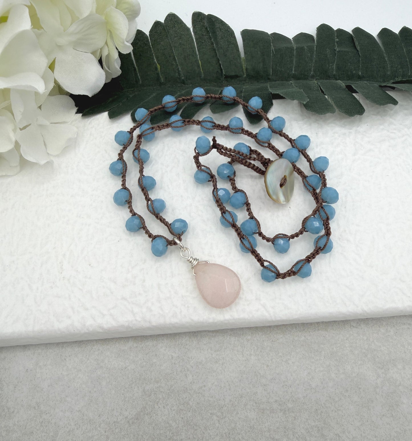 Crocheted Necklace with a Brown Cord, Blue Crystal Beads and a Pale Pink Jade Teardrop SN-687