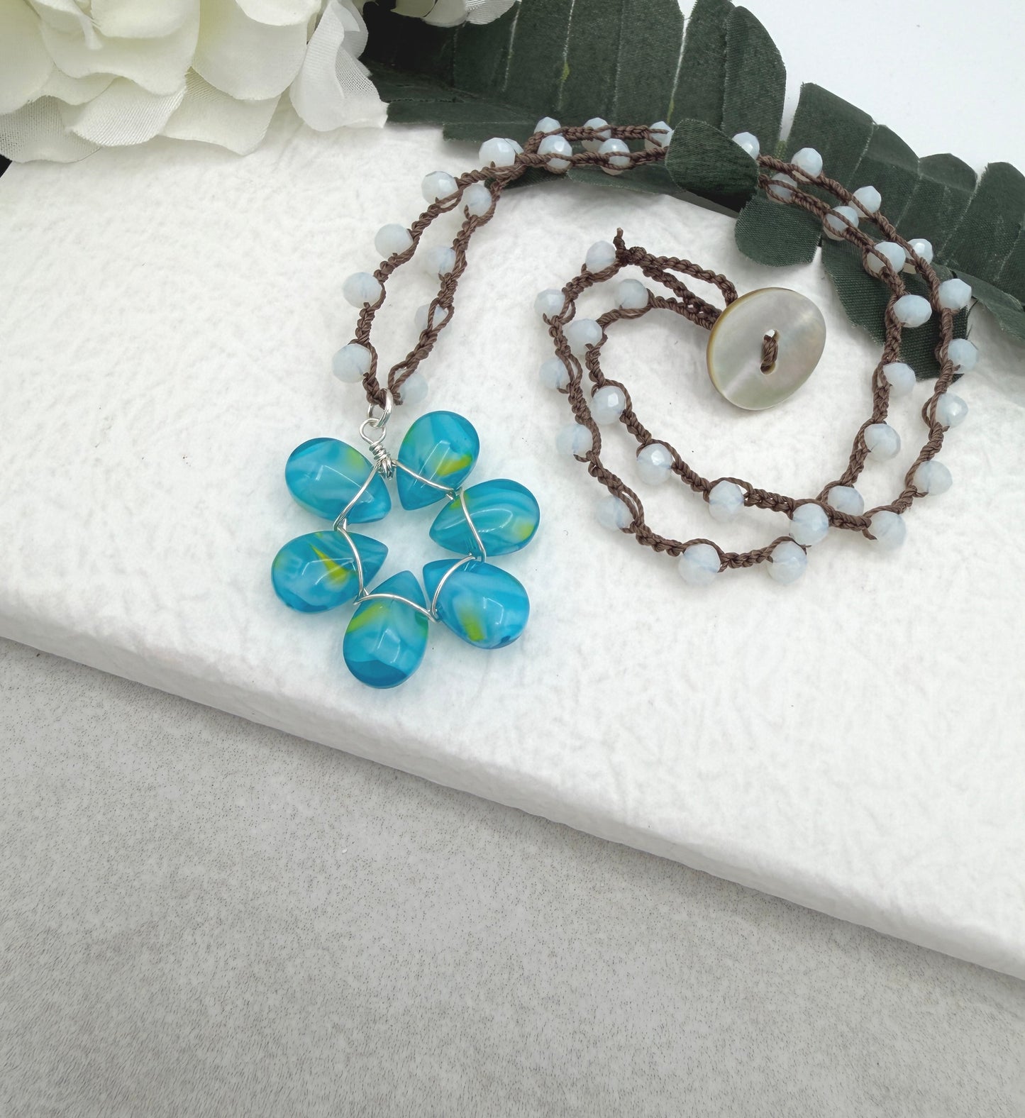 Crocheted Necklace with a Brown Cord, White Crystals and a Blue and Yellow Glass Teardrop Flower SN-688