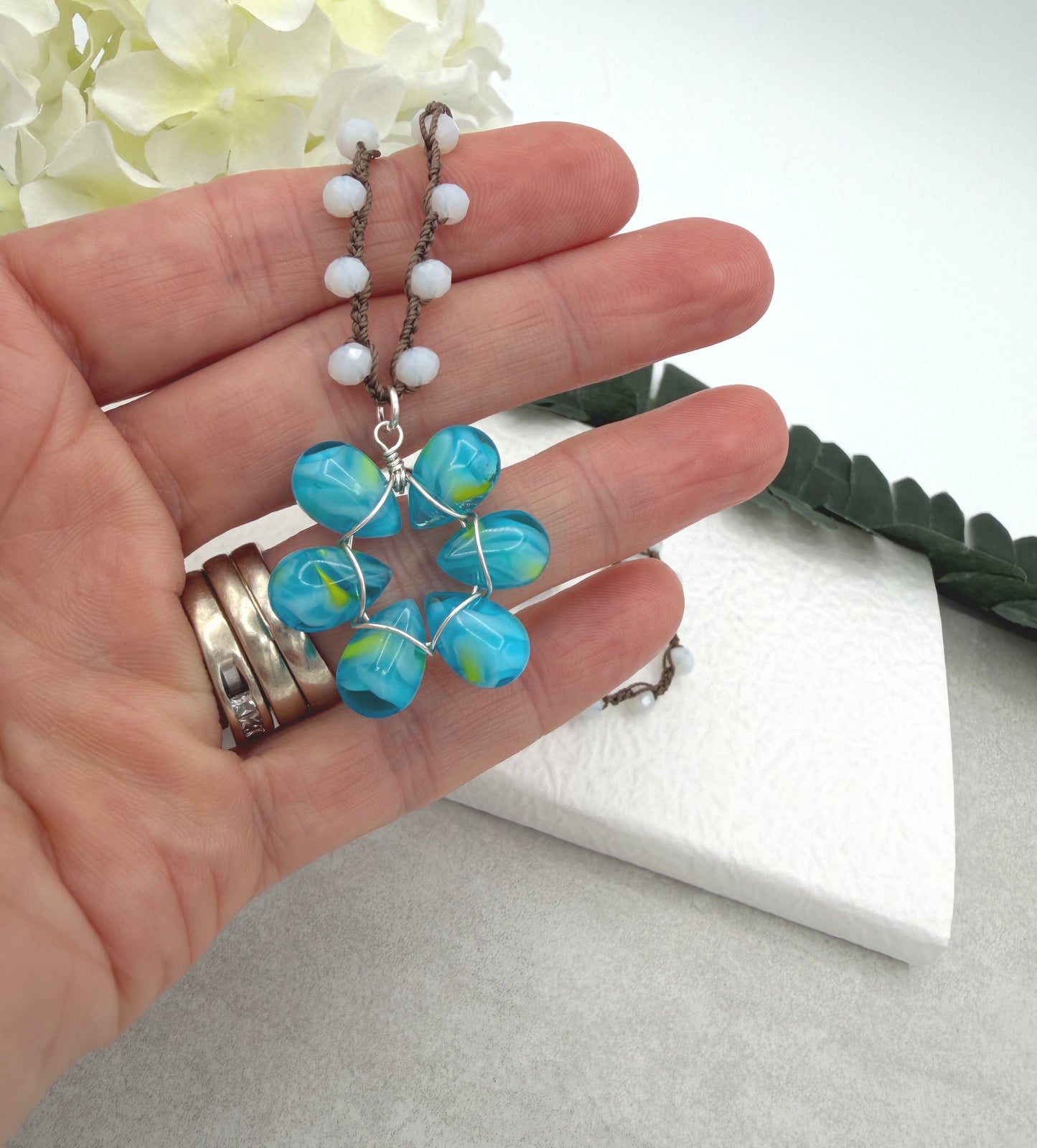 Crocheted Necklace with a Brown Cord, White Crystals and a Blue and Yellow Glass Teardrop Flower SN-688
