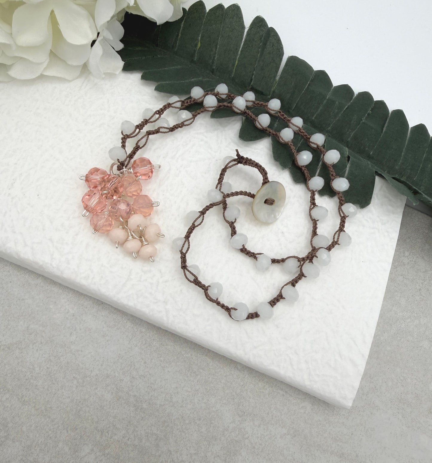 Crocheted Necklace with a Brown Cord, White Crystals and a Cluster of Pink, Peach and Cream Crystals SN-689