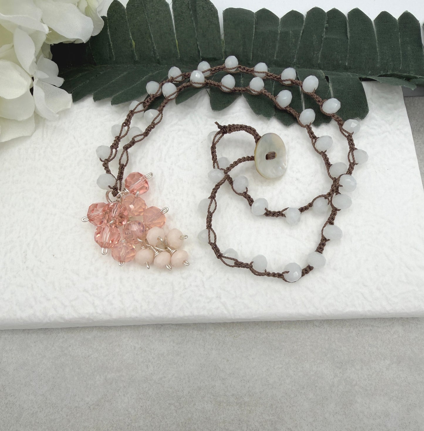 Crocheted Necklace with a Brown Cord, White Crystals and a Cluster of Pink, Peach and Cream Crystals SN-689