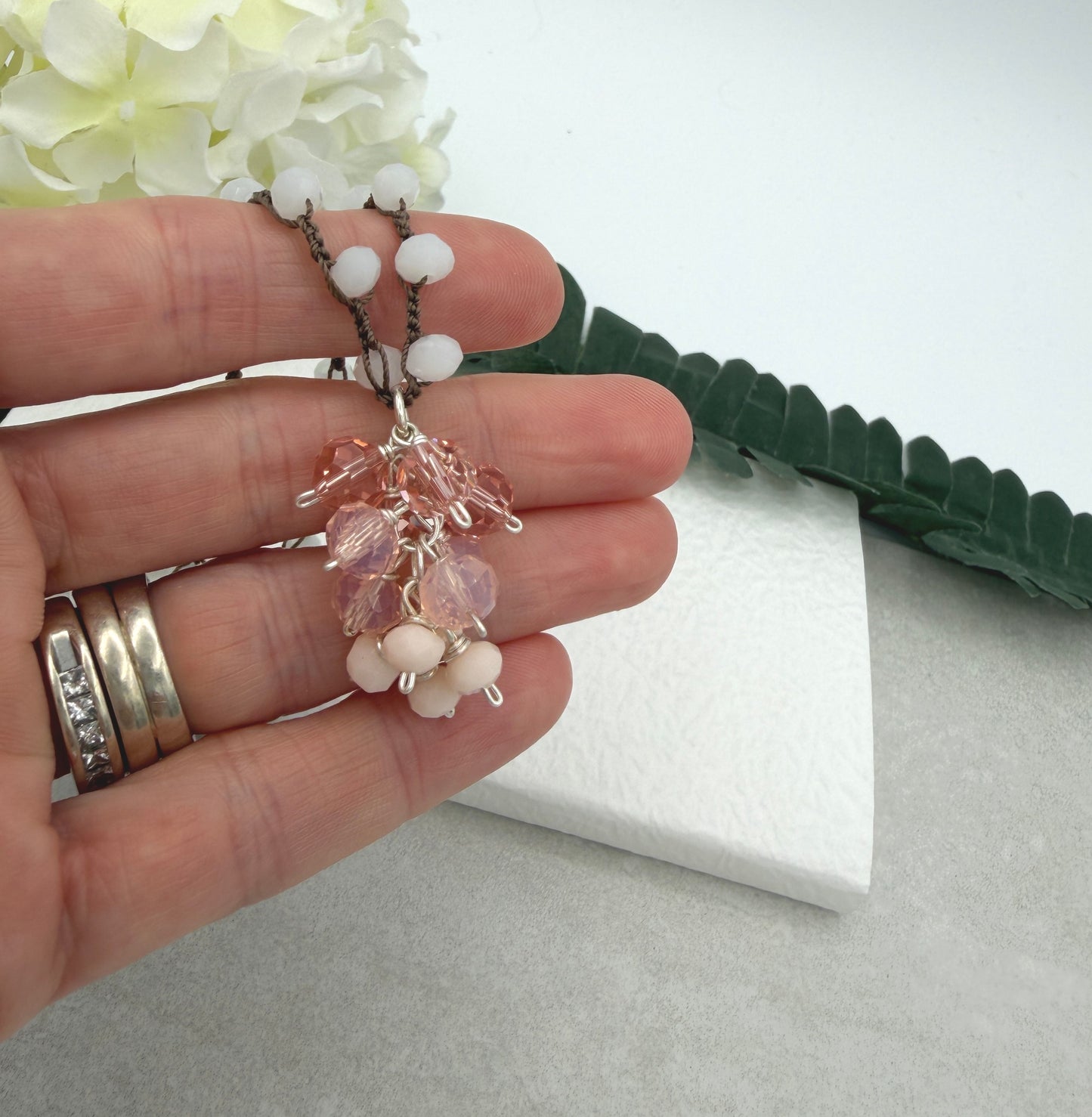 Crocheted Necklace with a Brown Cord, White Crystals and a Cluster of Pink, Peach and Cream Crystals SN-689