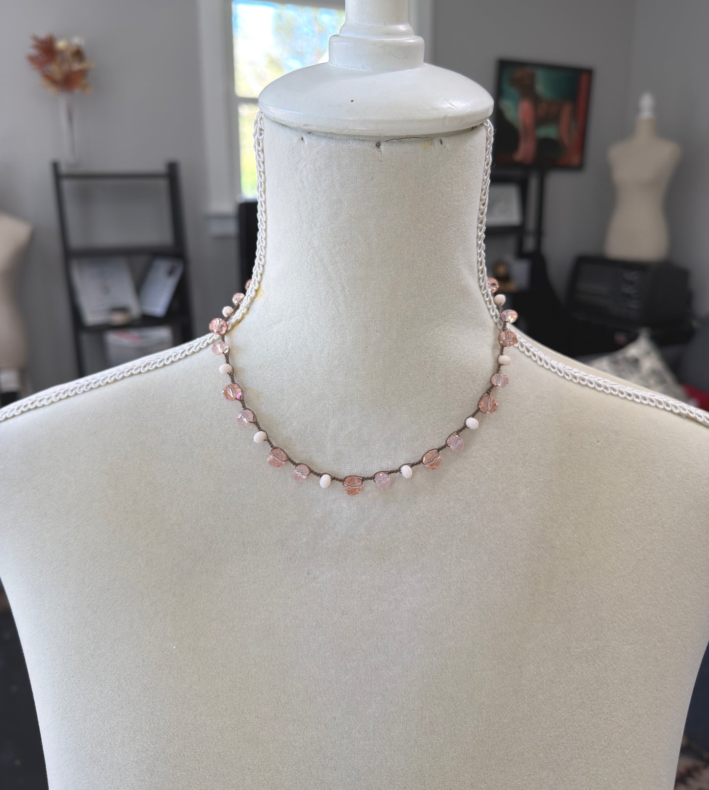 A Crocheted Necklace with a Brown Cord With Pink, Peach and Cream Crystal Beads SN-690