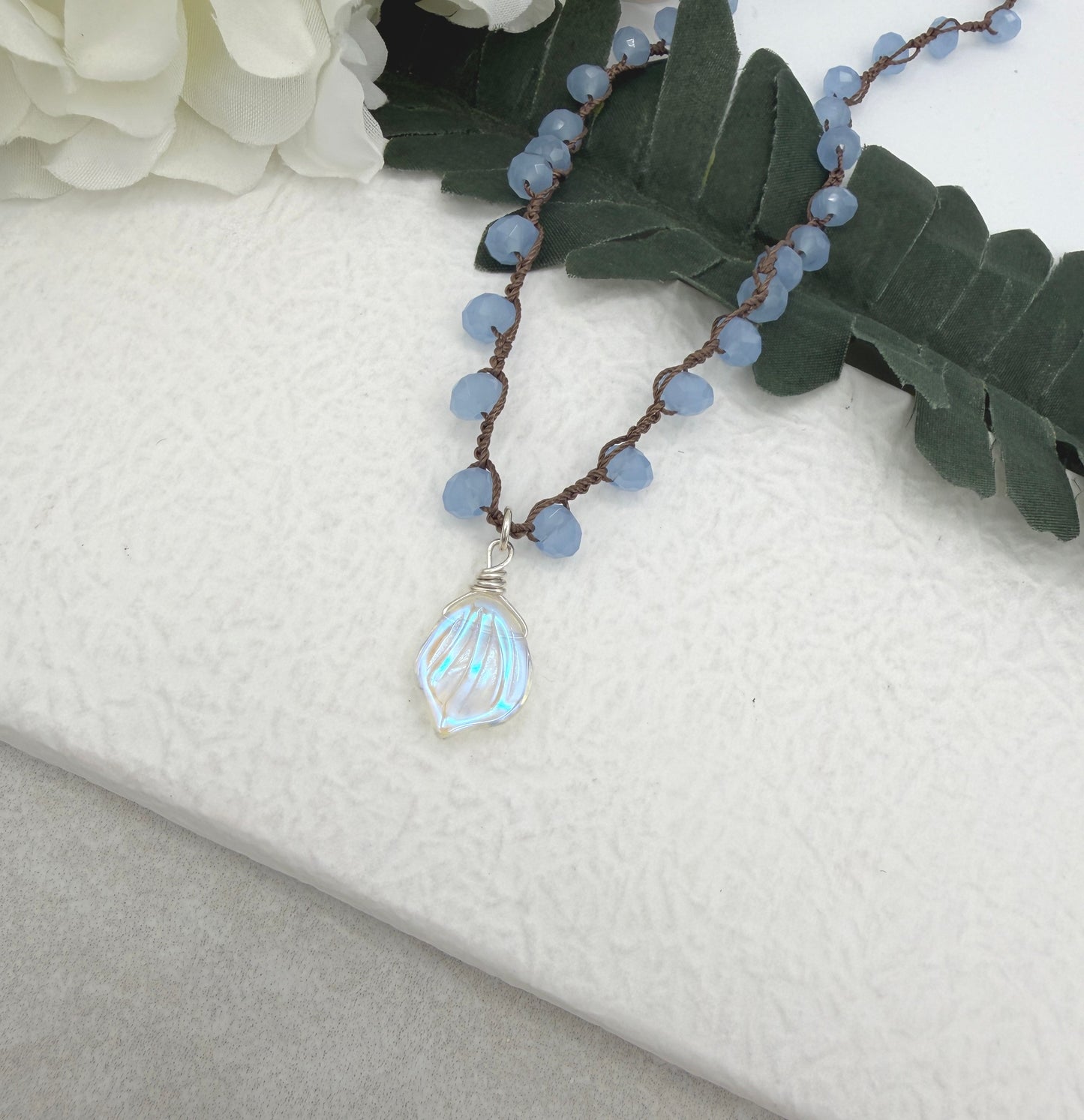 Crocheted Necklace with a Brown Cord, Blue Crystal Beads and a Clear AB Glass Leaf Bead Pendant SN-691