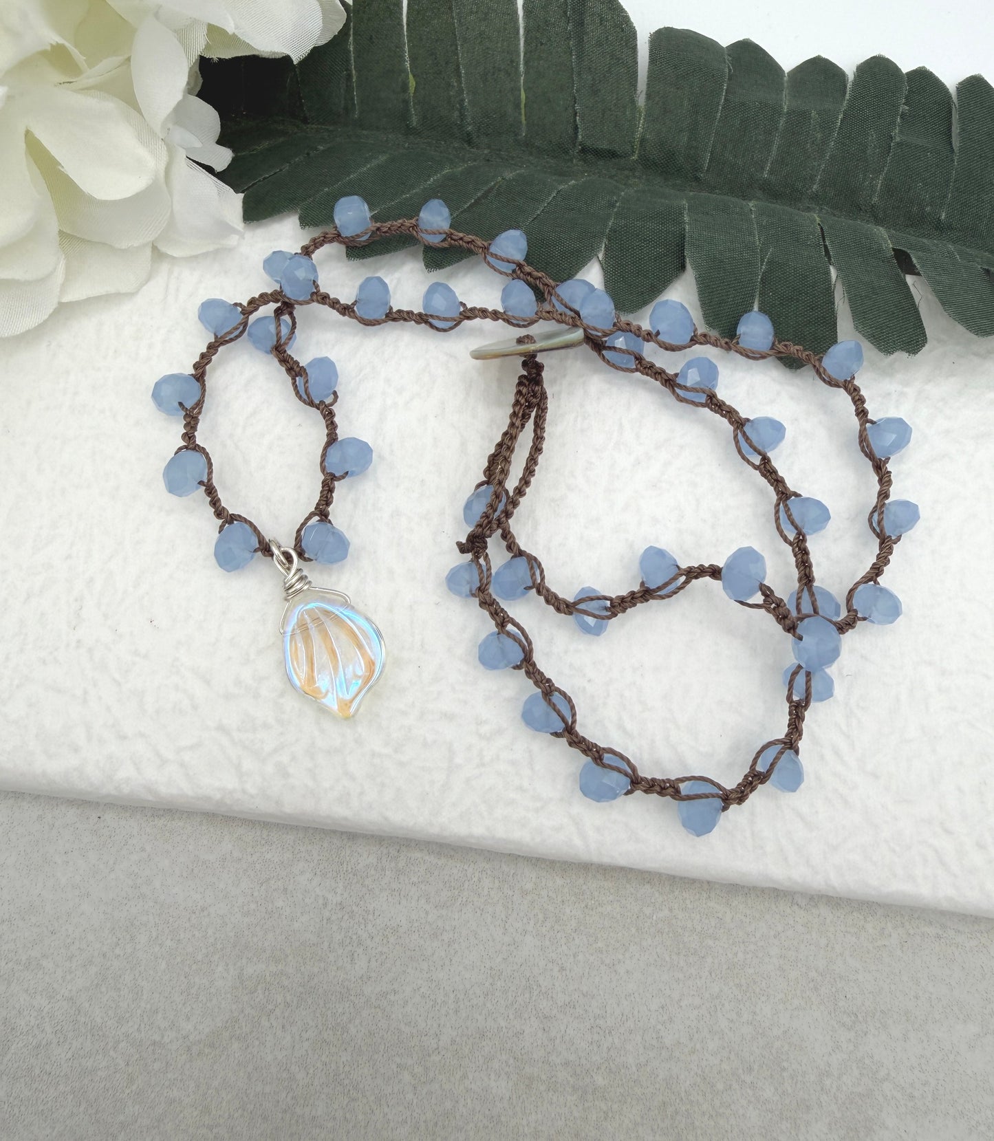 Crocheted Necklace with a Brown Cord, Blue Crystal Beads and a Clear AB Glass Leaf Bead Pendant SN-691