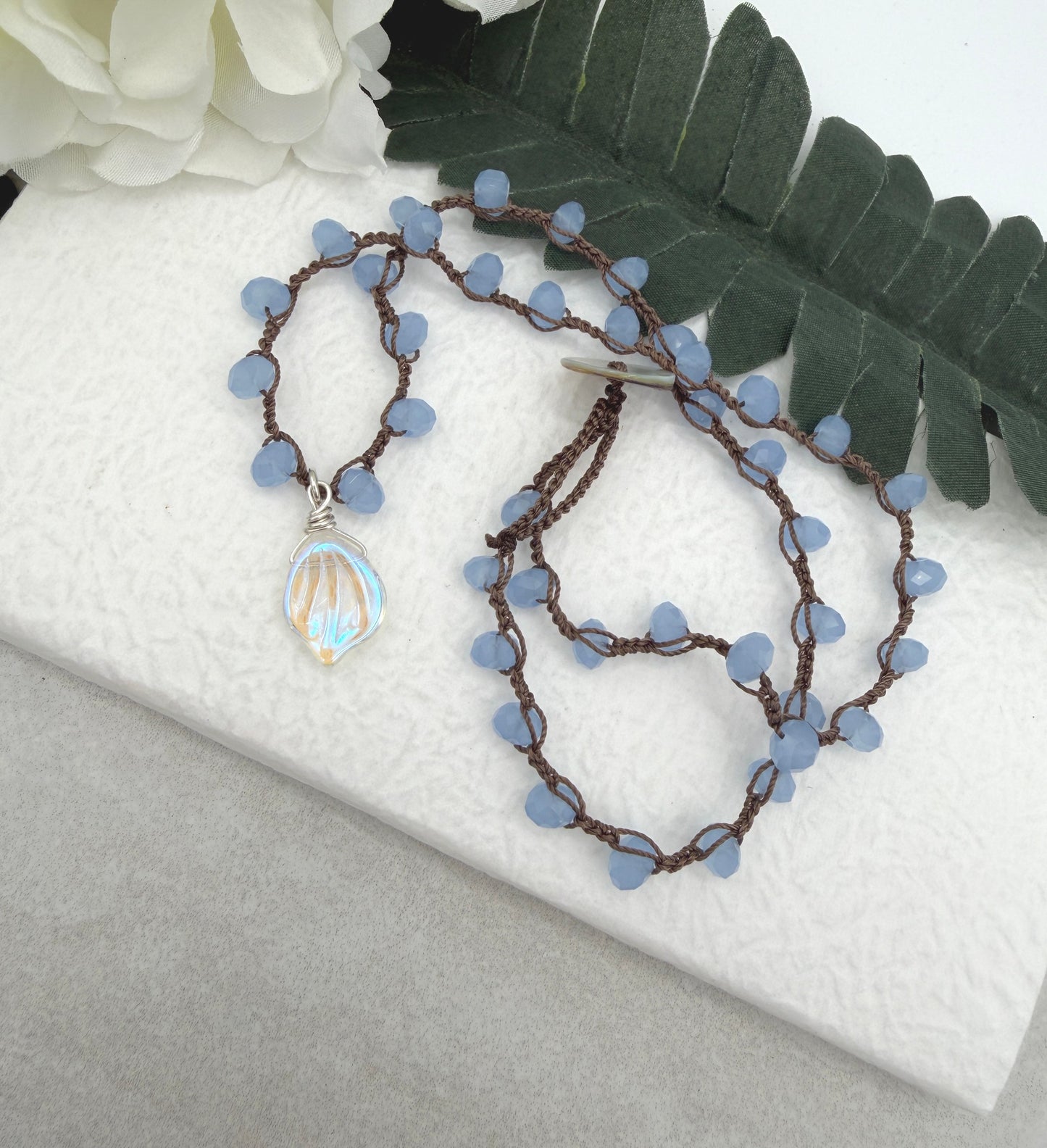 Crocheted Necklace with a Brown Cord, Blue Crystal Beads and a Clear AB Glass Leaf Bead Pendant SN-691