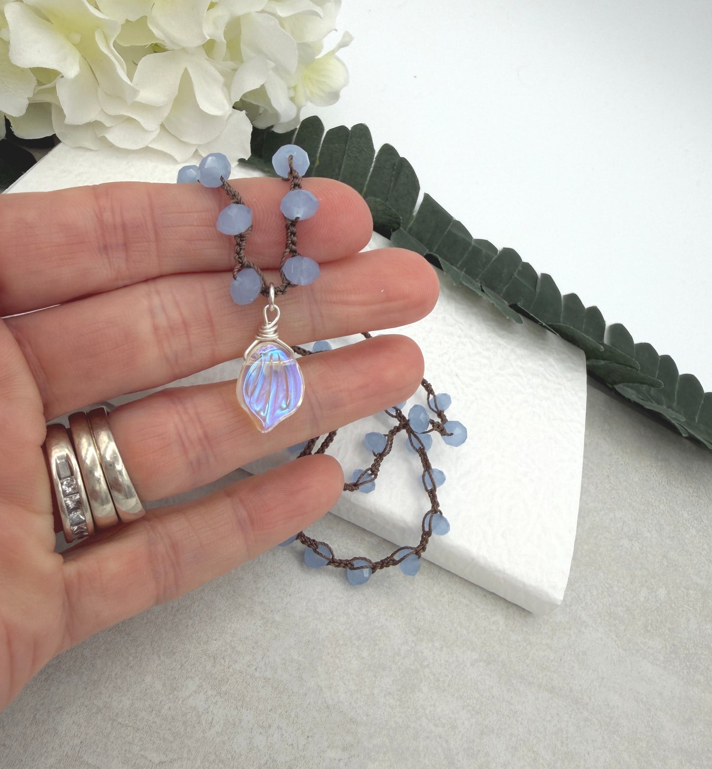 Crocheted Necklace with a Brown Cord, Blue Crystal Beads and a Clear AB Glass Leaf Bead Pendant SN-691
