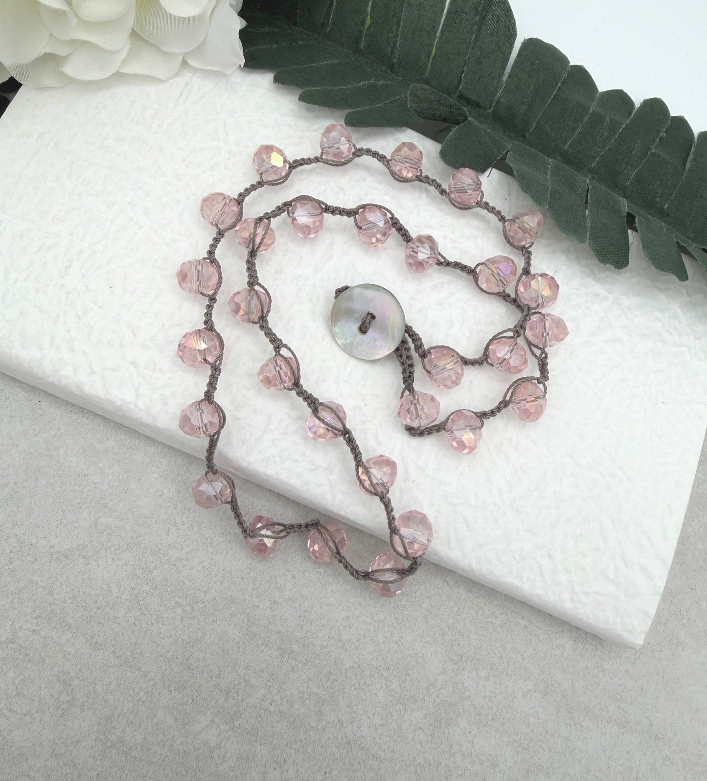 Crocheted Necklace with a Greige Cord and Pink Crystal Beads SN-693