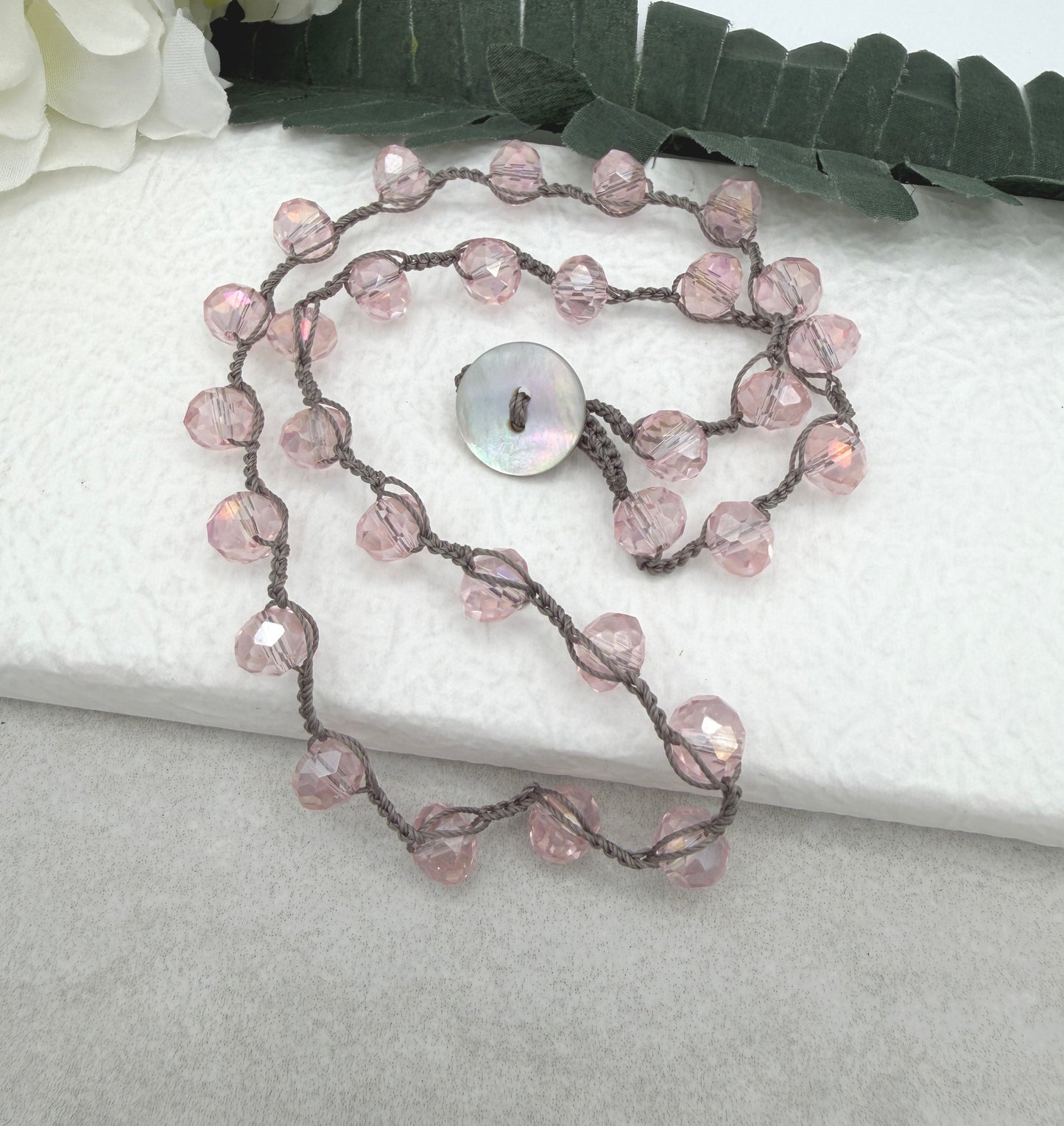Crocheted Necklace with a Greige Cord and Pink Crystal Beads SN-693