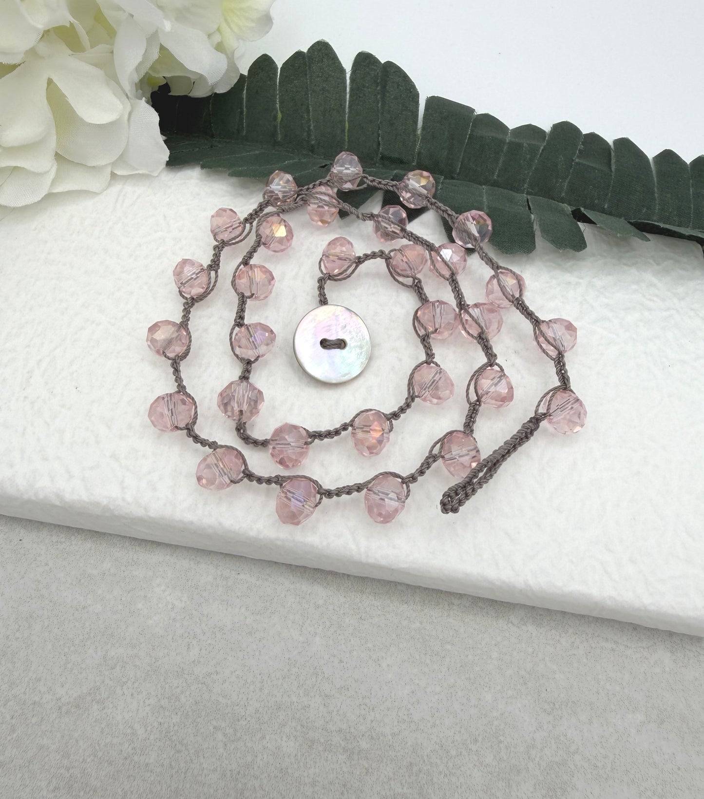 Crocheted Necklace with a Greige Cord and Pink Crystal Beads SN-693