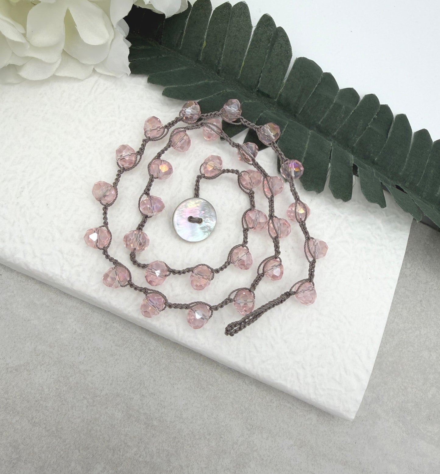 Crocheted Necklace with a Greige Cord and Pink Crystal Beads SN-693