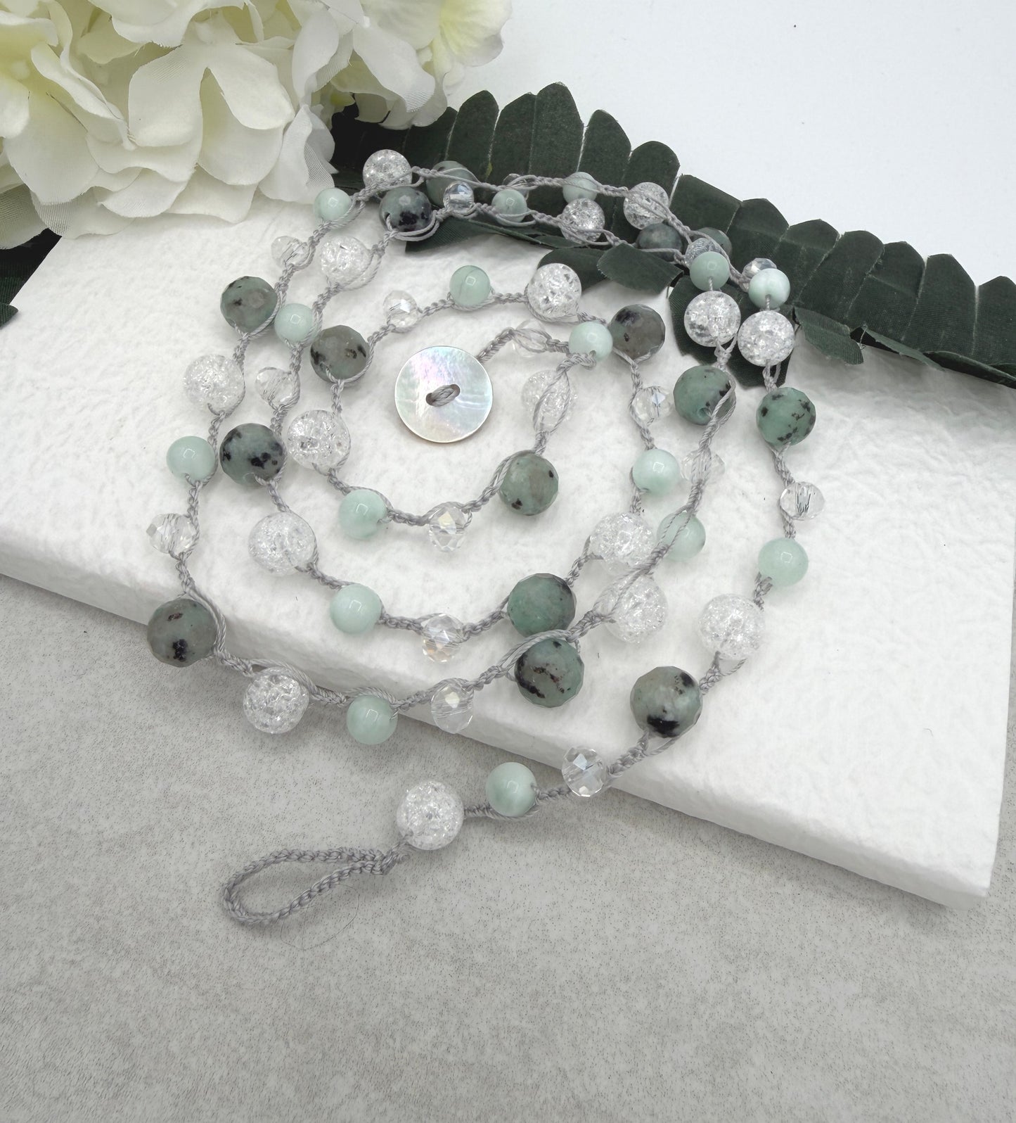 A Long Crocheted Necklace with a Light Gray Cord With Agate, Crackled Quartz and Crystal Beads SN-694