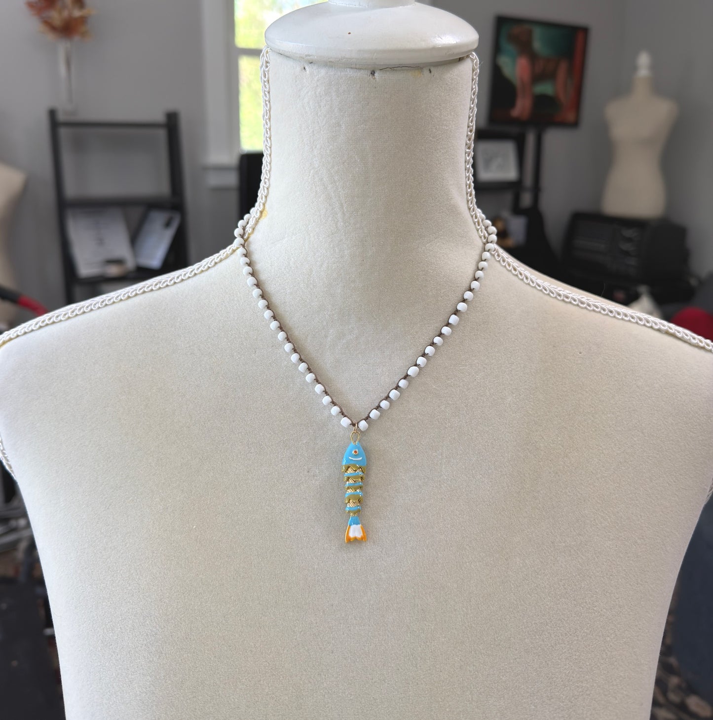 Crocheted Necklace with a Brown Cord, White Glass Beads and a Turquoise, Orangle Enameled Fish Charm SN-695