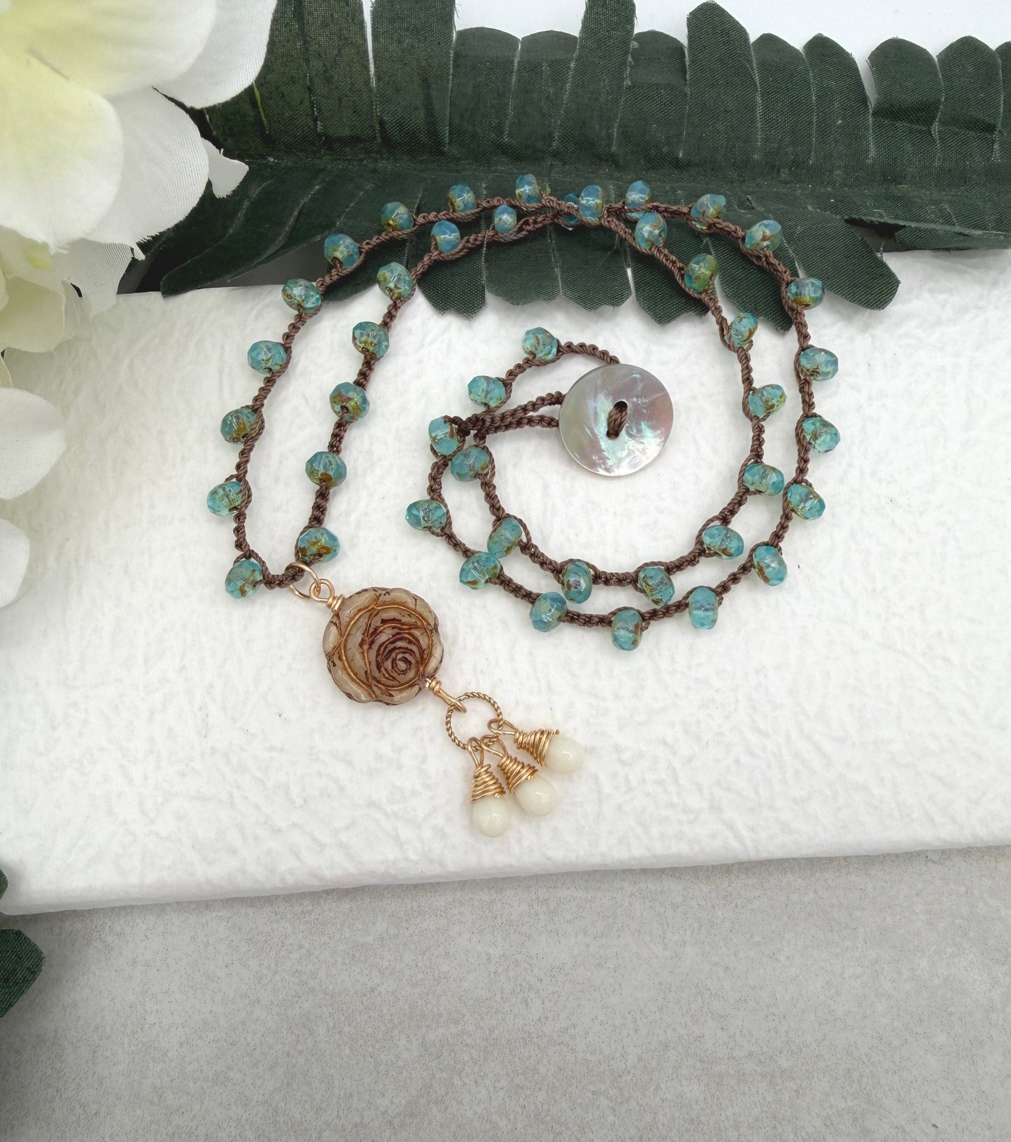 Crocheted Necklace with a Brown Cord, Aqua Glass Beads and a Czech Glass Rose, Braided Loop and Cream Glass Pendant SN-701