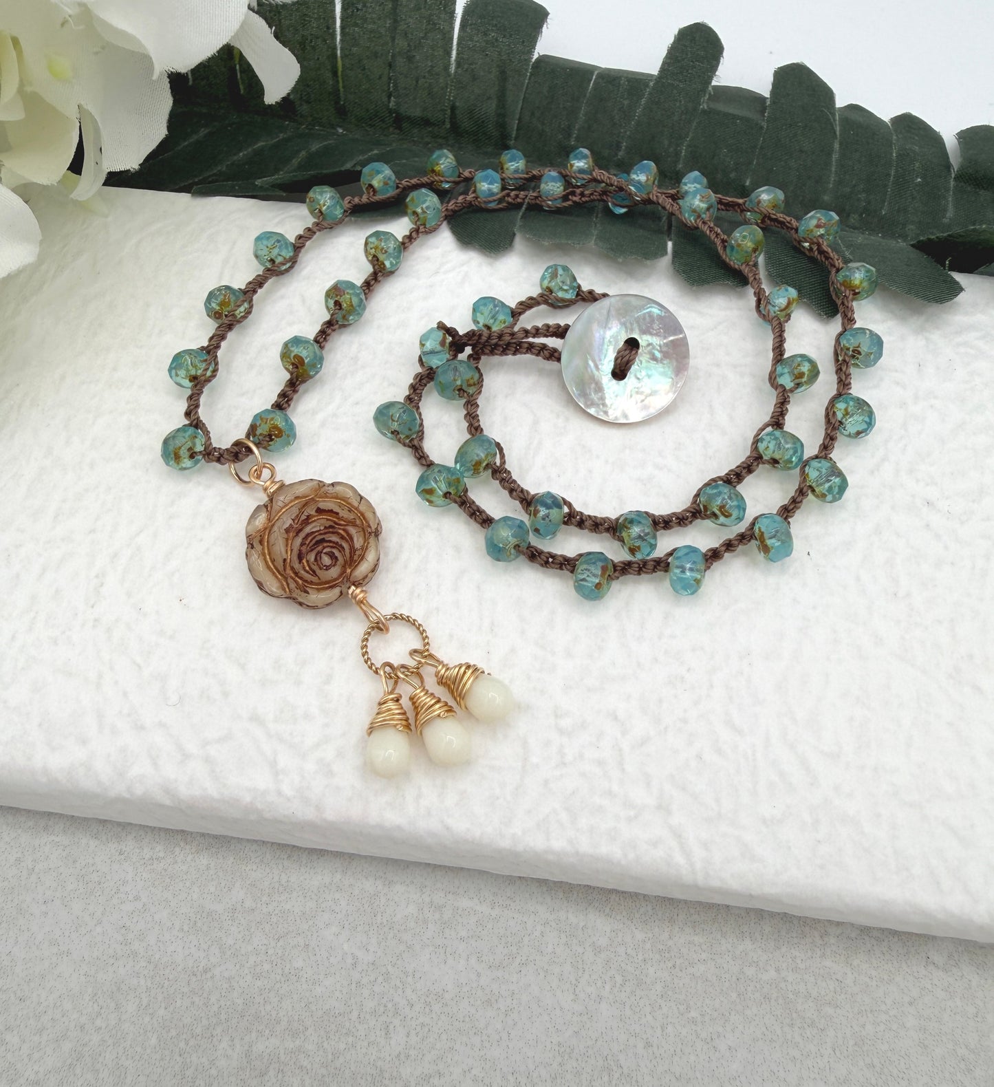 Crocheted Necklace with a Brown Cord, Aqua Glass Beads and a Czech Glass Rose, Braided Loop and Cream Glass Pendant SN-701