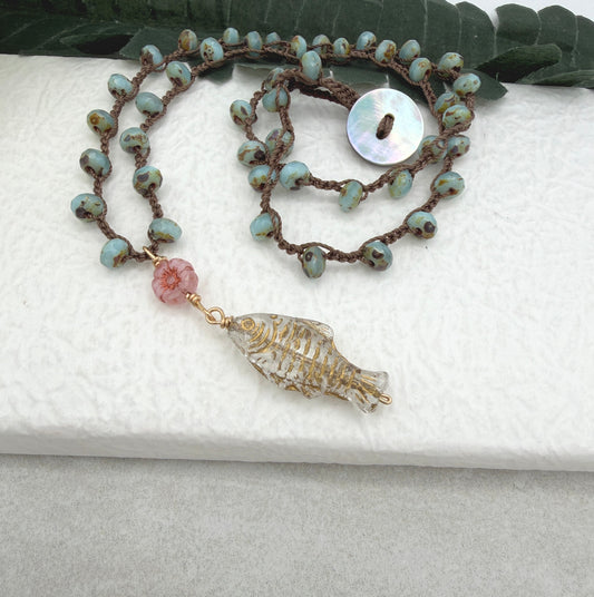 Crocheted Necklace with a Brown Cord, Blue Glass Beads, a Czech Glass Pink Flower, and Gold Glass Fish Bead
