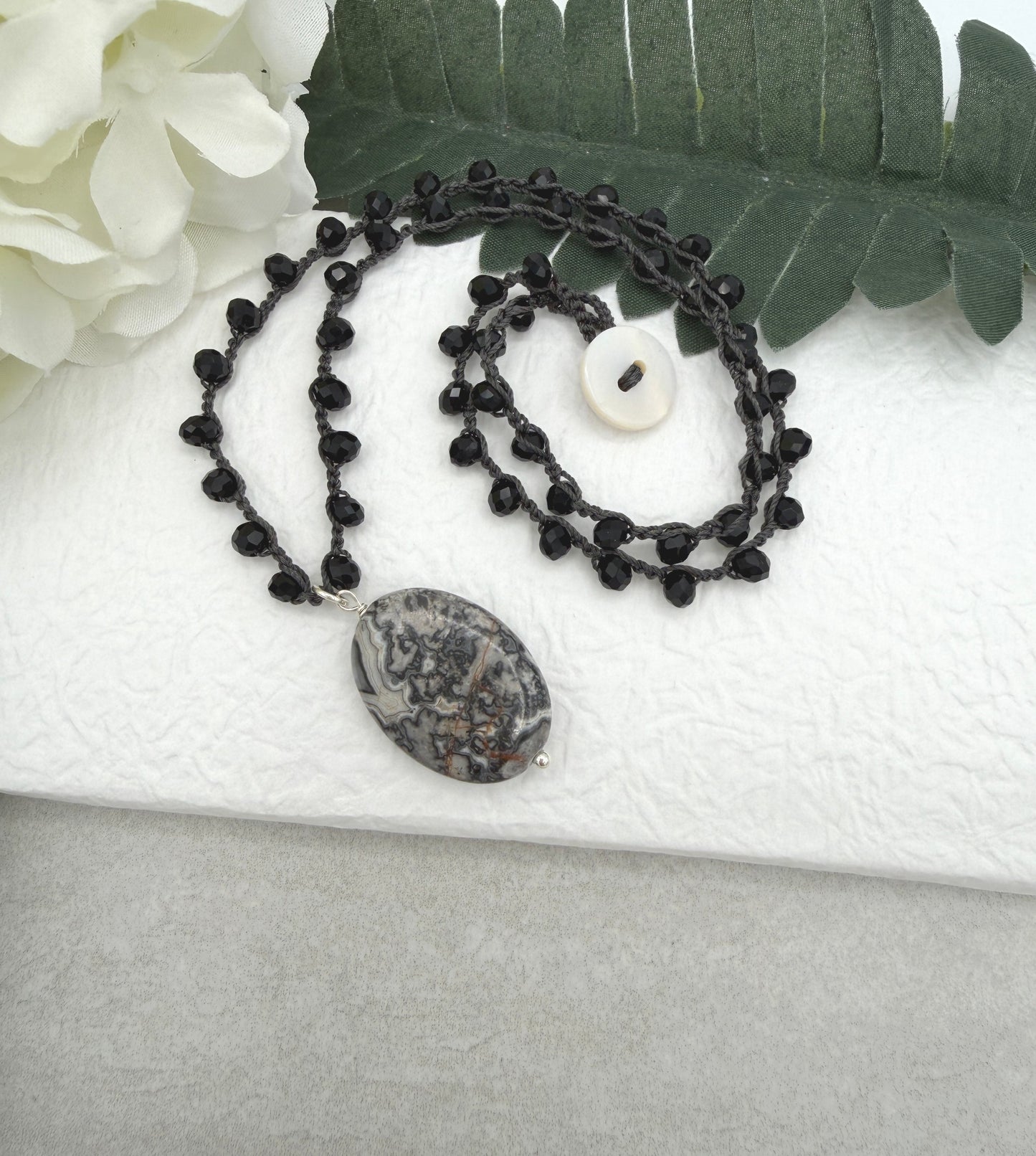 Crocheted Necklace with a Dark Gray Cord, Black Crystal Beads and a Silver Leopard Jasper Pendant SN-703